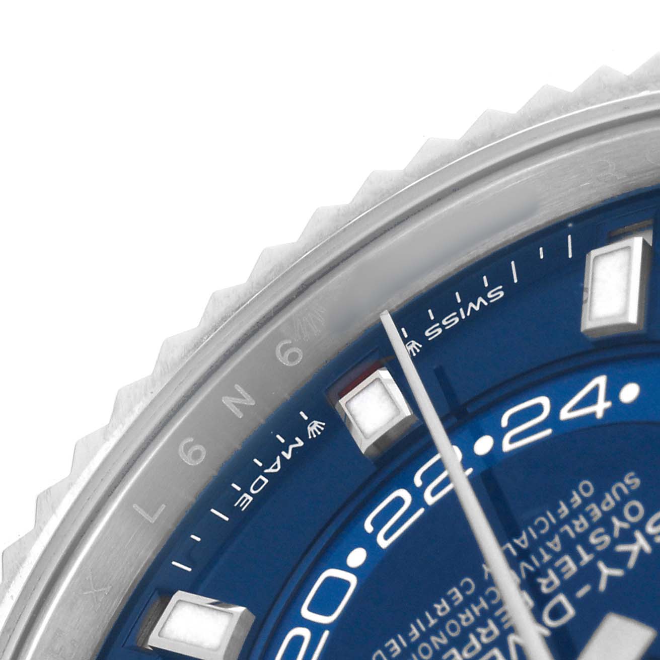 The image shows a close-up of the Rolex Sky-Dweller 336934 Men's Stainless Steel Blue Dial's blue dial and bezel, highlighting the hour markers and part of the minute hand.