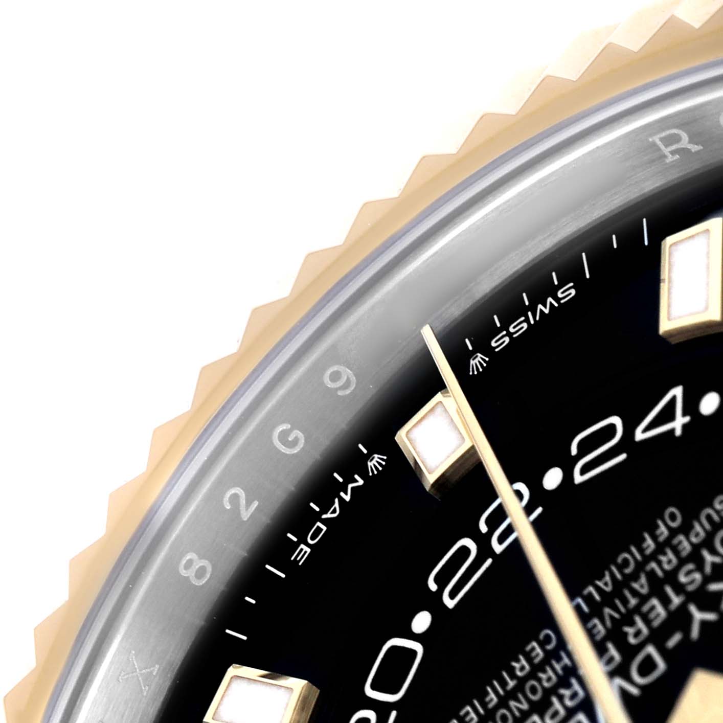 The image shows a close-up of the dial and fluted bezel of a Rolex Sky-Dweller 336933 Men's Steel and Gold (two tone) Black Dial, focusing on the hour markers and part of the dial.