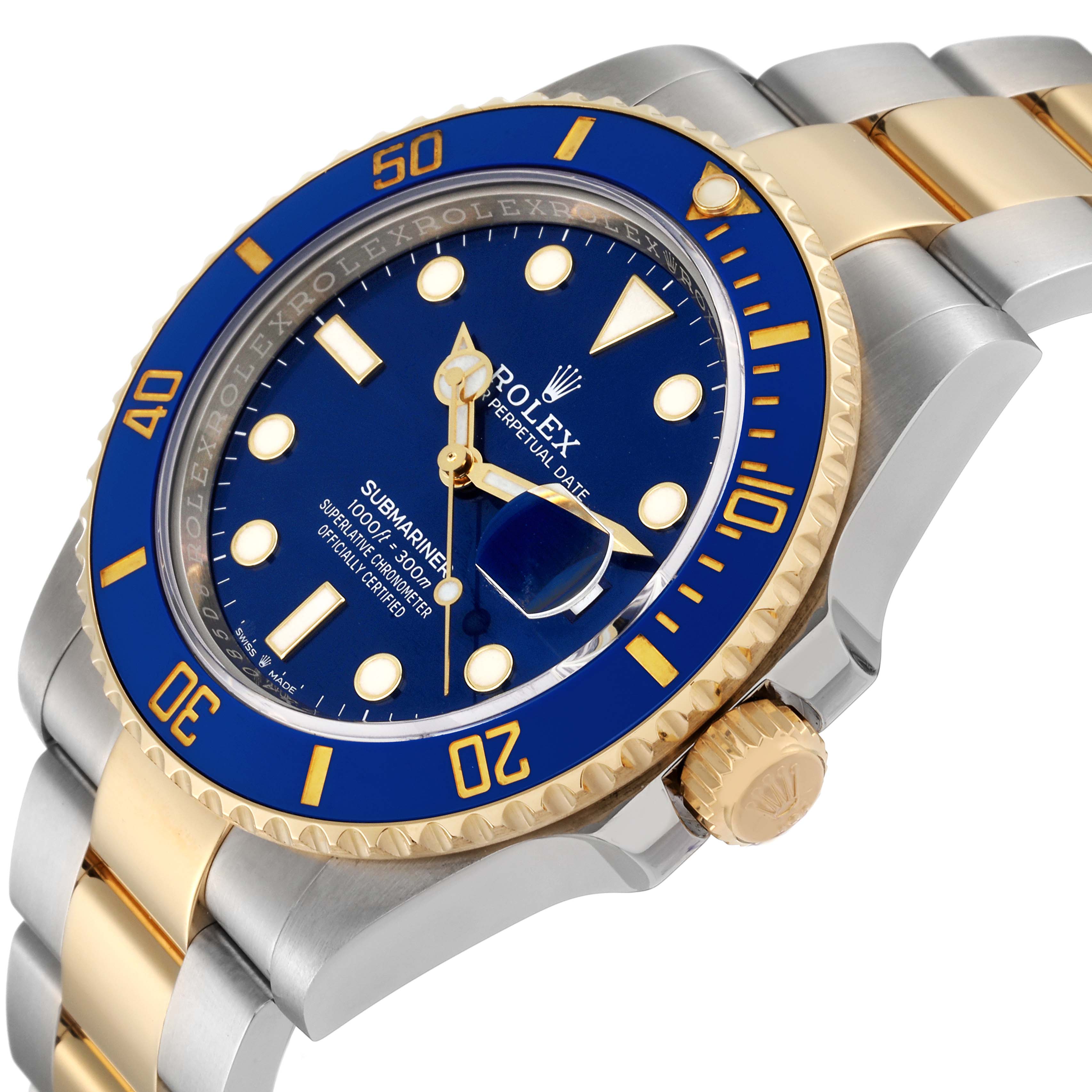 The image shows a side angle of a Rolex Submariner 126613 Men
s Steel and Gold (two tone) Blue Dial 126613 Men
s Steel and Gold (two tone) Blue Dial with a blue bezel and dial, gold accents, and portion of the two-tone metallic bracelet.