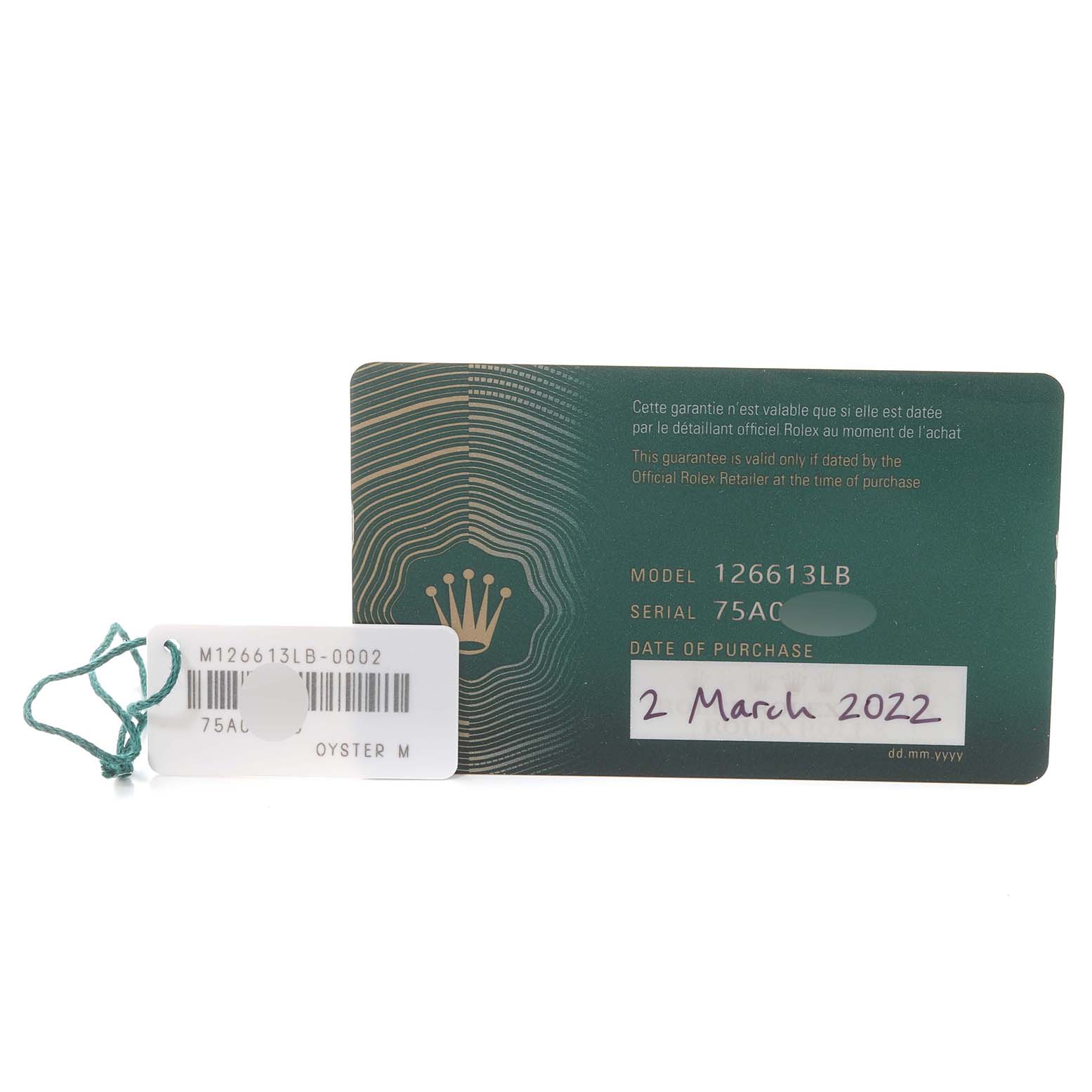 The image displays the warranty card and tag for a Rolex Submariner 126613 Men
s Steel and Gold (two tone) Blue Dial 126613 Men
s Steel and Gold (two tone) Blue Dial model 126613LB, including serial number and date of purchase.