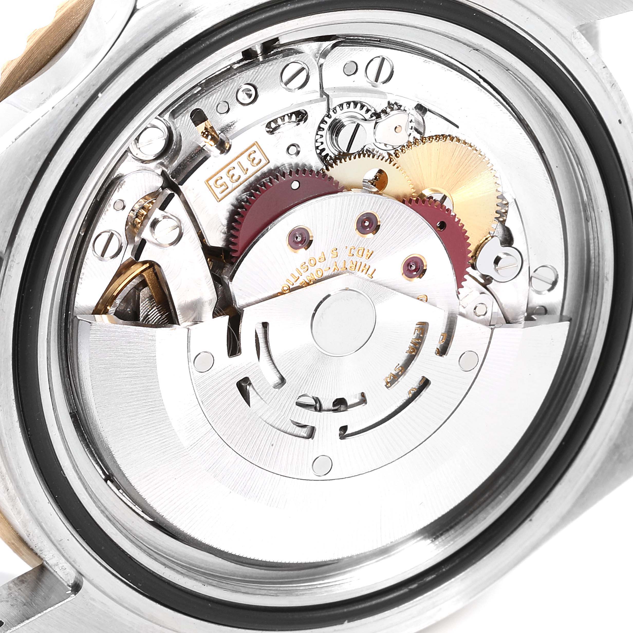The image shows the internal mechanism of a Rolex Submariner 16613 Men
s Steel and Gold (two tone) Blue Dial 16613 Men
s Steel and Gold (two tone) Blue Dial watch, viewed from the back.