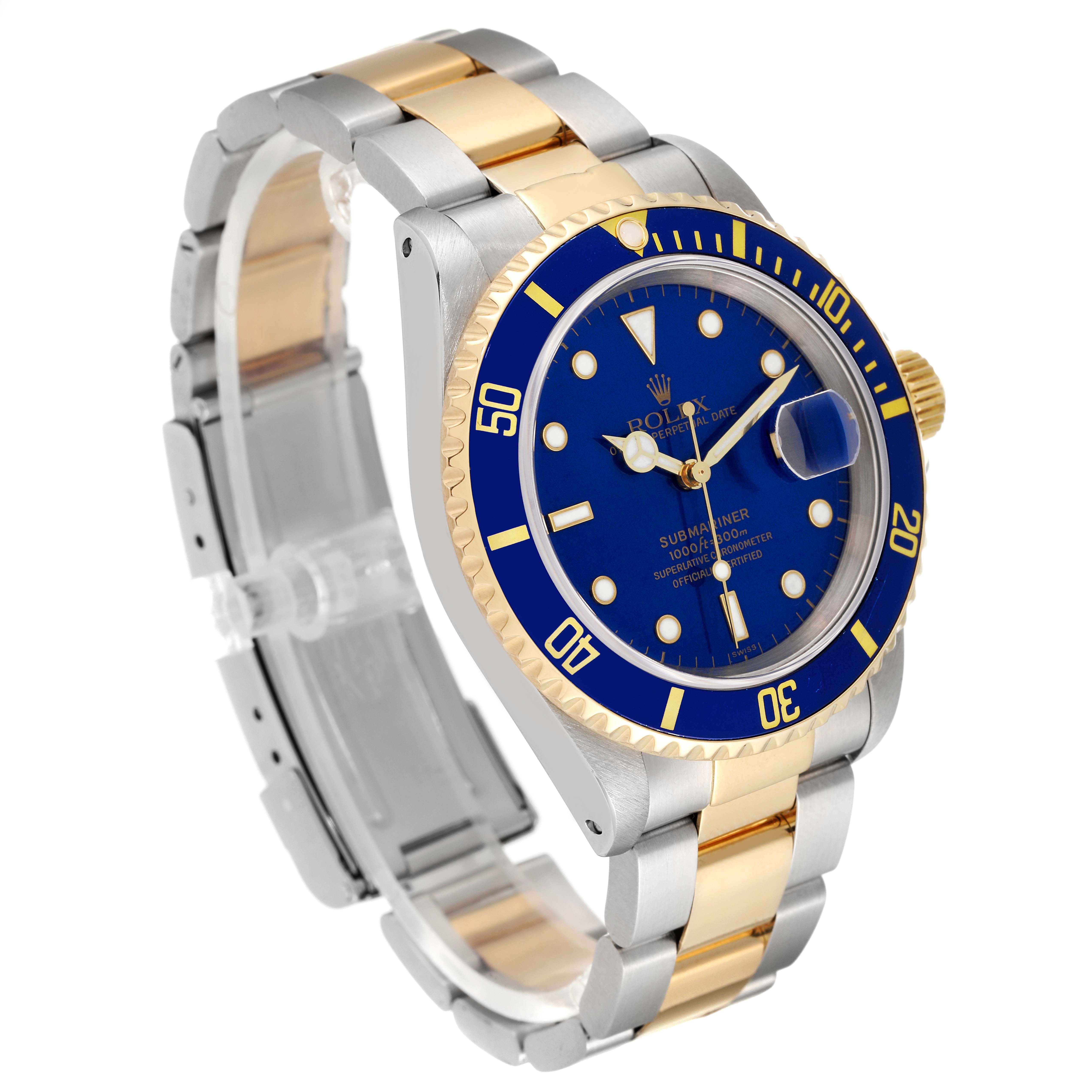 The image shows a Rolex Submariner 16613 Men
s Steel and Gold (two tone) Blue Dial 16613 Men
s Steel and Gold (two tone) Blue Dial from an angled view, illustrating its blue dial, bezel, and two-tone bracelet.