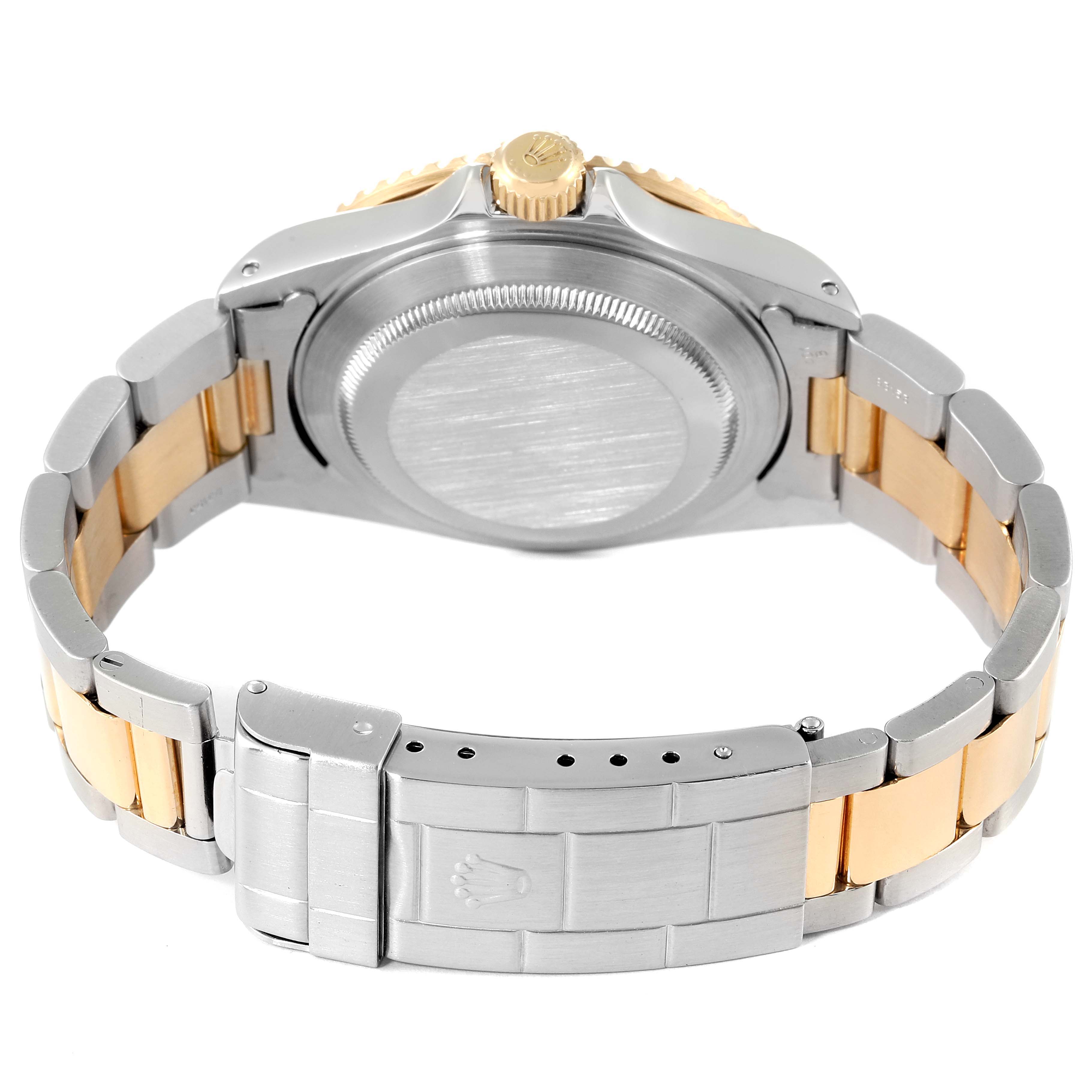 This image shows the back of the Rolex Submariner 16613 Men
s Steel and Gold (two tone) Blue Dial 16613 Men
s Steel and Gold (two tone) Blue Dial, highlighting the watch case and the two-tone bracelet.