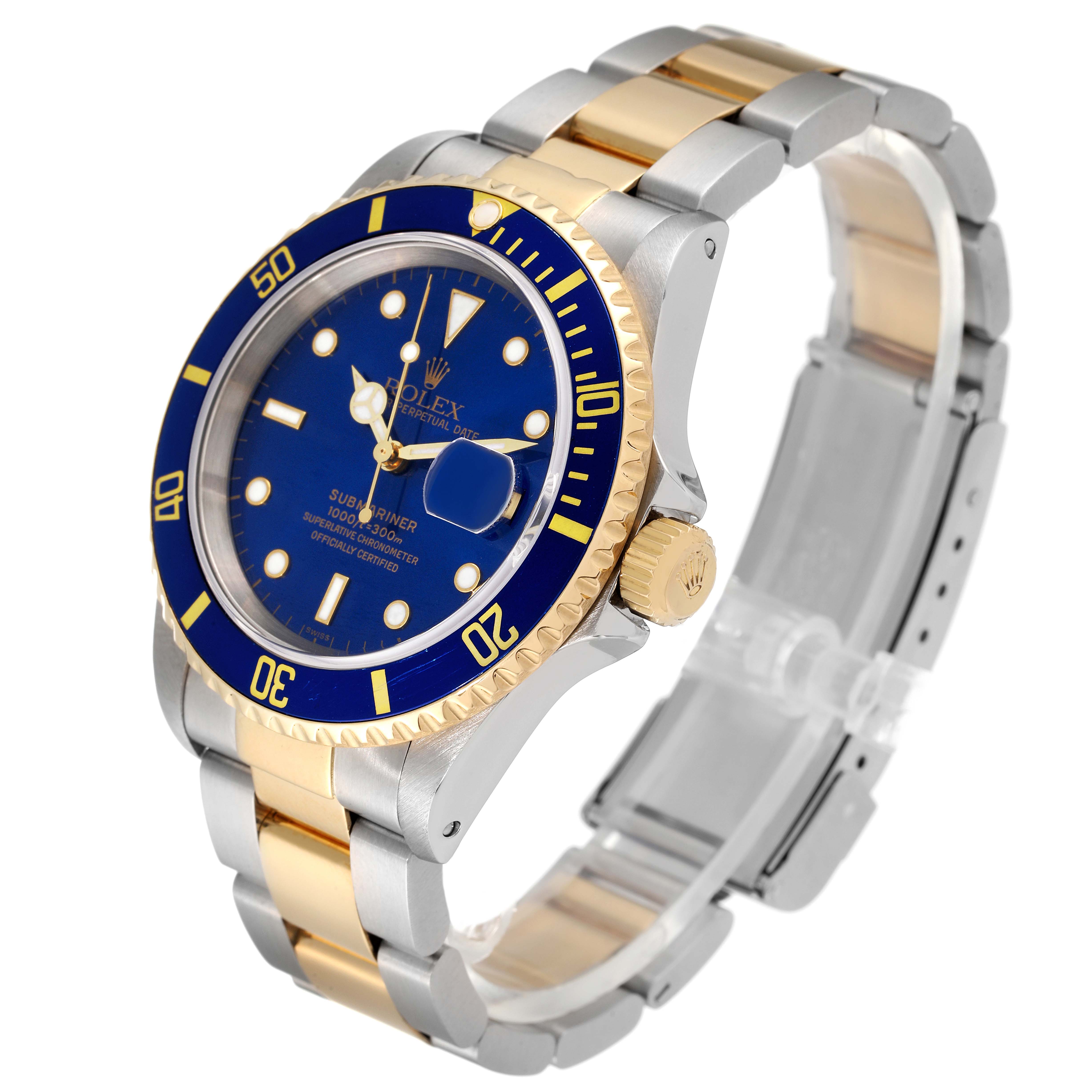 The image shows a Rolex Submariner 16613 Men
s Steel and Gold (two tone) Blue Dial 16613 Men
s Steel and Gold (two tone) Blue Dial watch at a three-quarter angle, highlighting the blue dial, bezel, and two-tone bracelet.