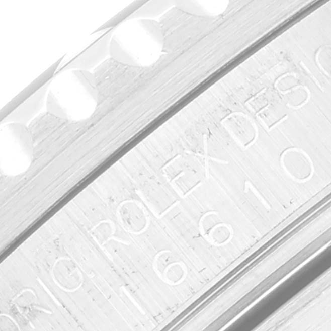 This image shows a close-up angle of the engraved model number and design text on the bezel of a Rolex Submariner 16610 Men
s Stainless Steel Black Dial 16610 Men
s Stainless Steel Black Dial watch.