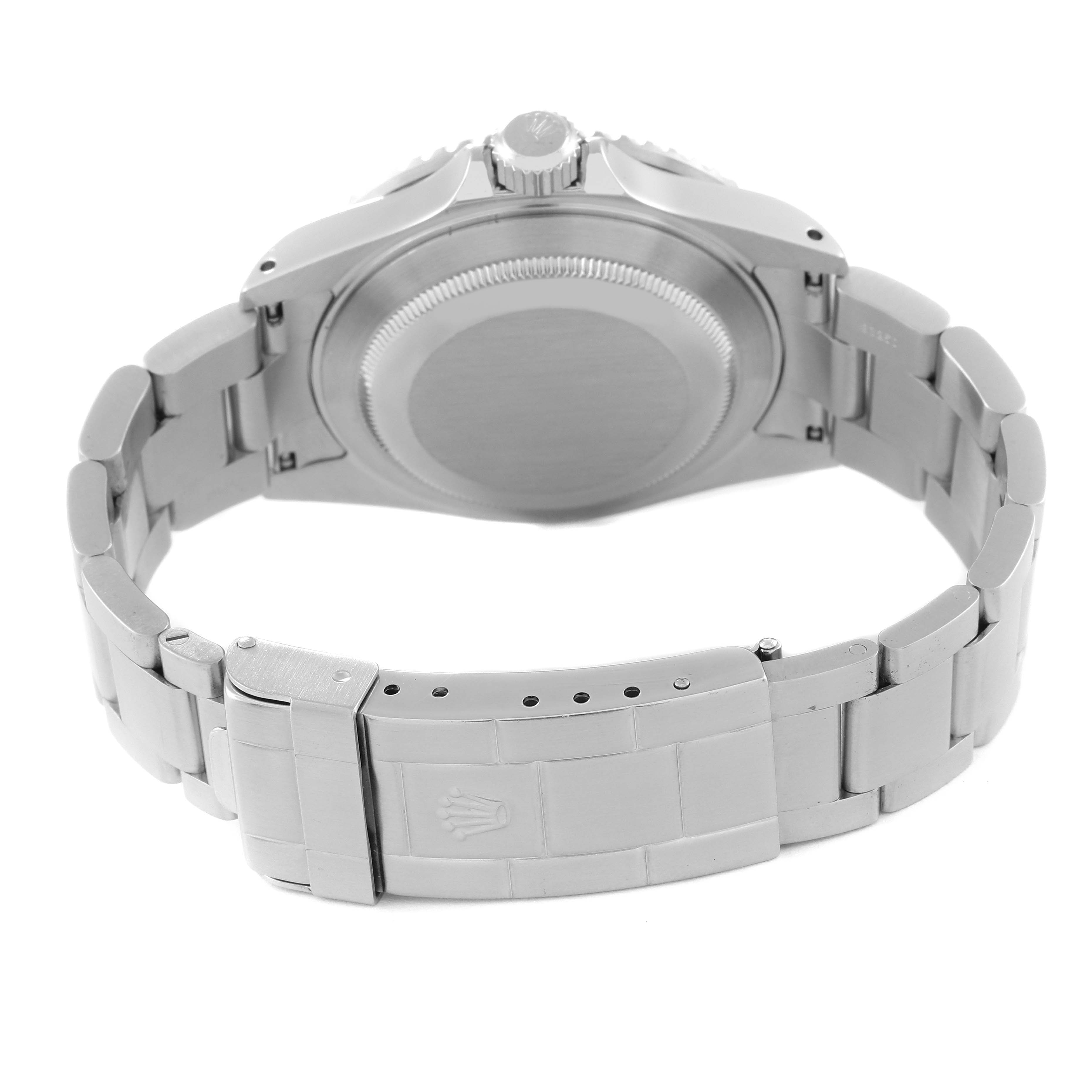 The image shows the back view of a Rolex Submariner 16610 Men
s Stainless Steel Black Dial 16610 Men
s Stainless Steel Black Dial watch, highlighting its clasp, bracelet, and case back.