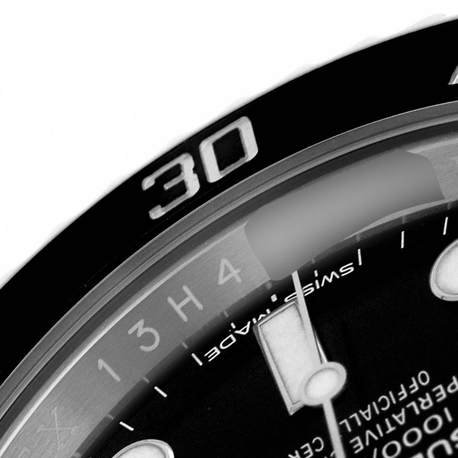 The image shows a close-up of the bezel and part of the dial of a Rolex Submariner 114060 Men's Stainless Steel Black Dial, highlighting the "30" minute mark.
