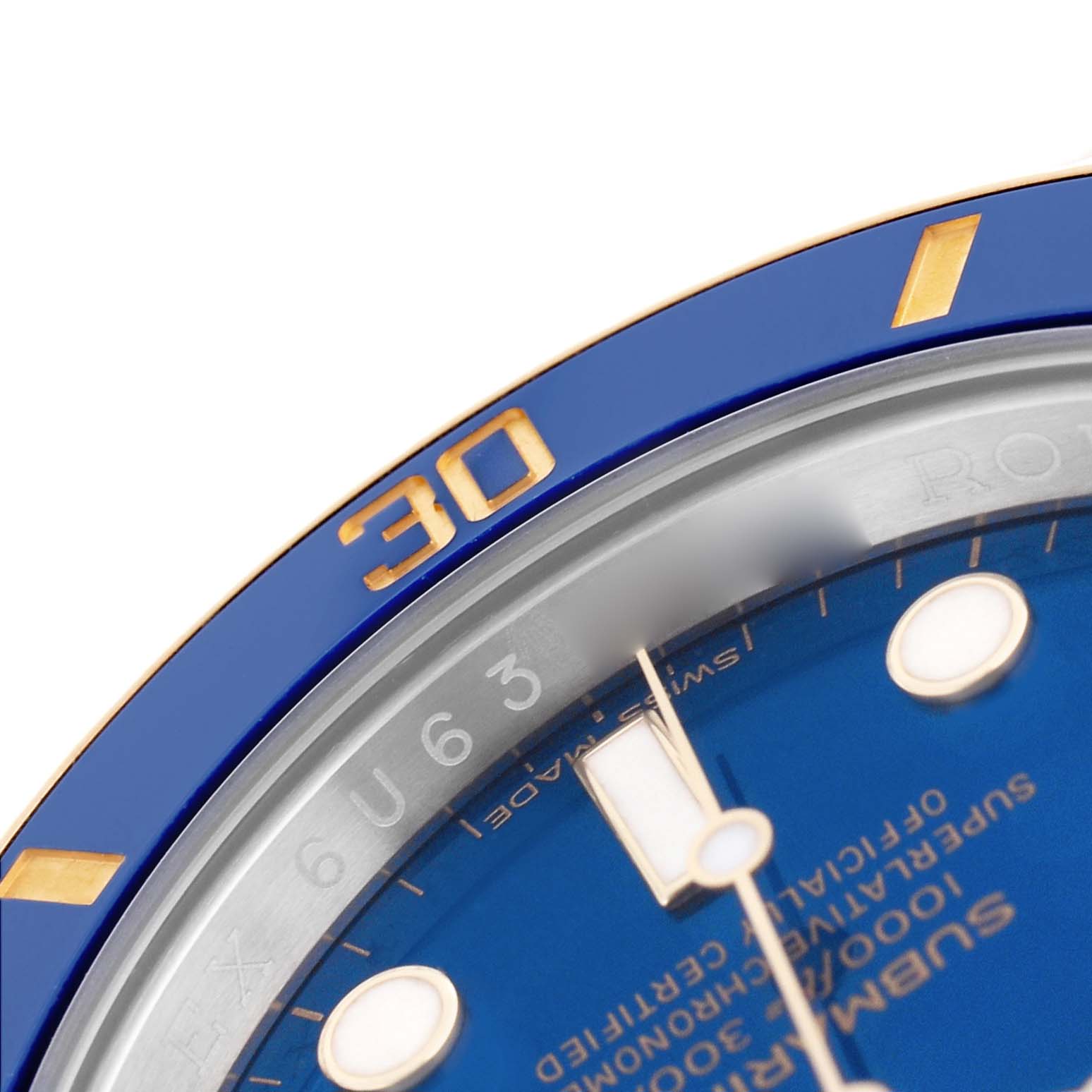 The image shows a close-up of the Rolex Submariner 116613 Men's Steel and Gold (two tone) Blue Dial's blue bezel, dial, and markers, focusing on the "30" mark.