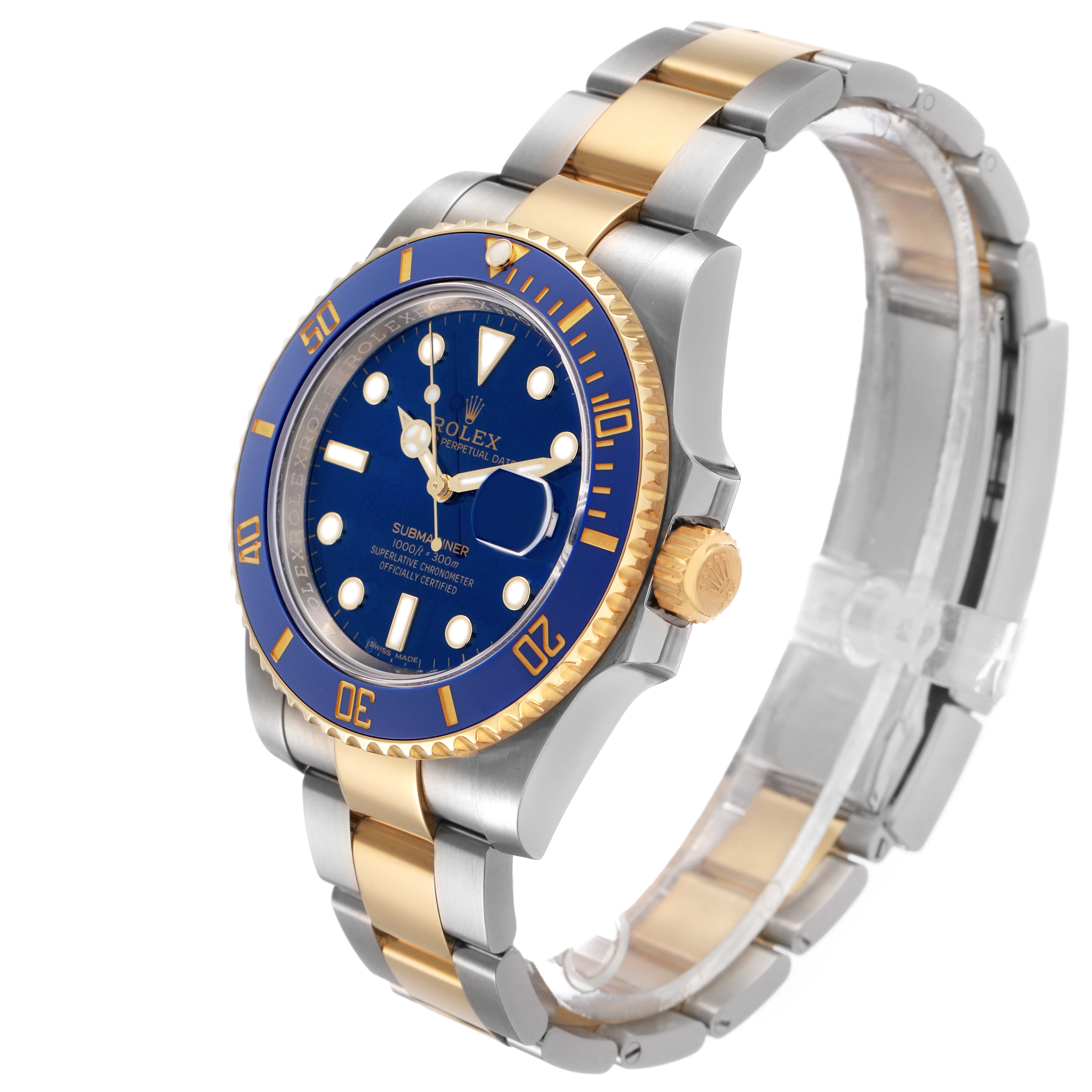 The Rolex Submariner 116613 Men's Steel and Gold (two tone) Blue Dial is shown at a three-quarter angle, highlighting the blue dial, gold and steel bracelet, and side crown.