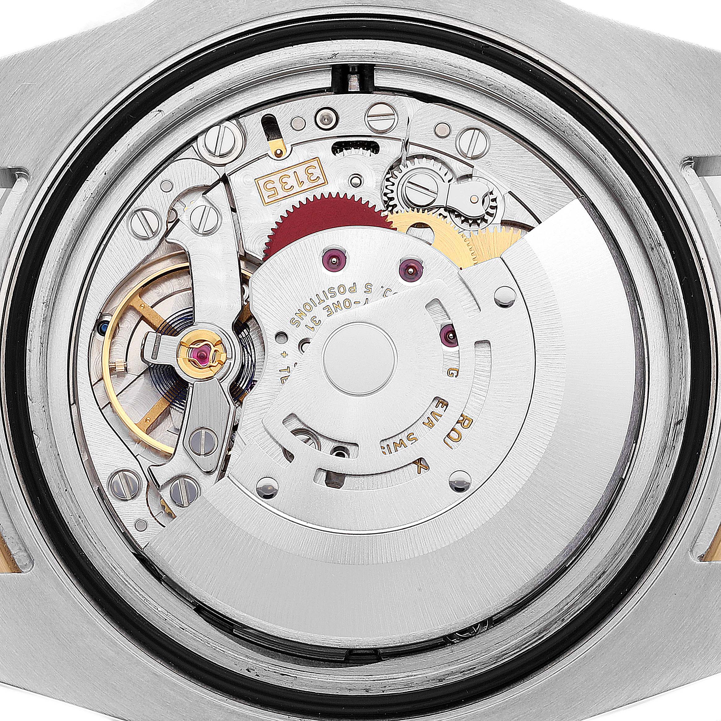 This image shows the intricate inner mechanism of a Rolex Submariner 116613 Men
s Steel and Gold (two tone) Blue Dial 116613 Men
s Steel and Gold (two tone) Blue Dial watch from a back or internal view.