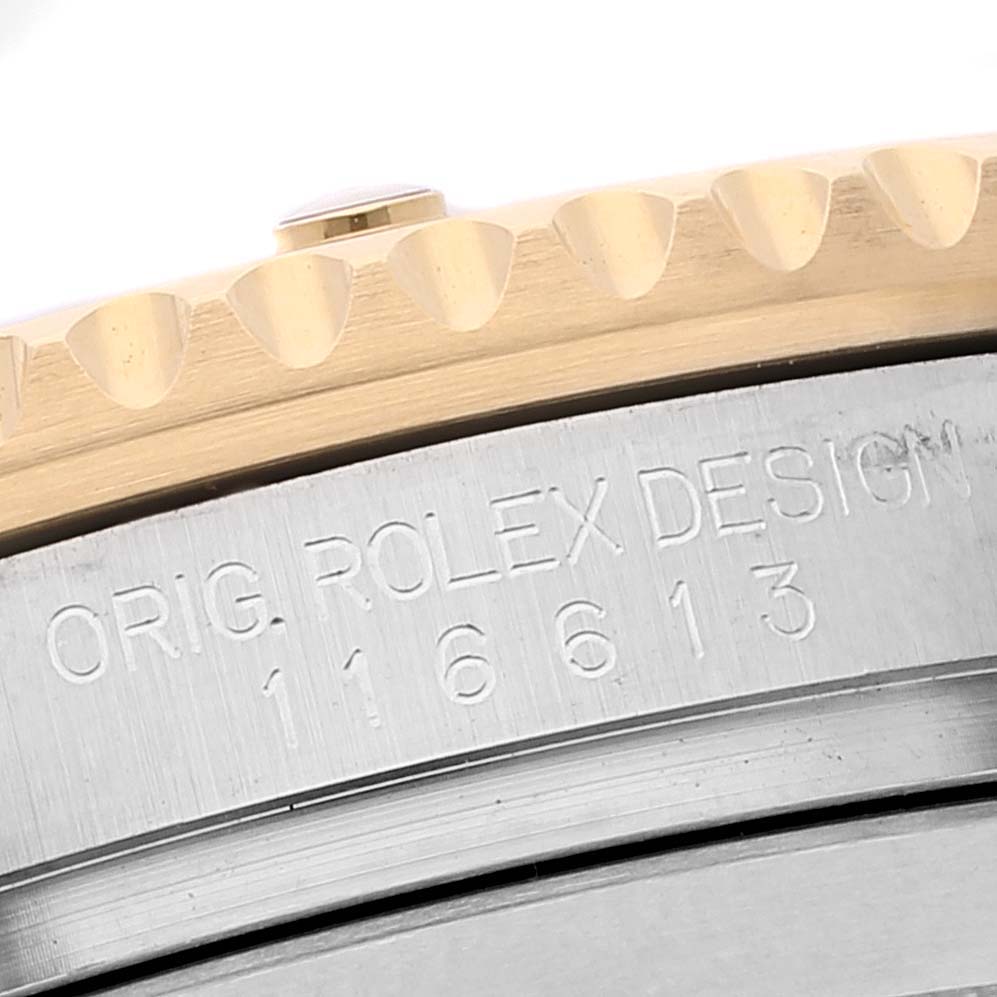 The image shows a close-up of the bezel and case side of a Rolex Submariner 116613 Men
s Steel and Gold (two tone) Blue Dial 116613 Men
s Steel and Gold (two tone) Blue Dial, with the model number engraved.