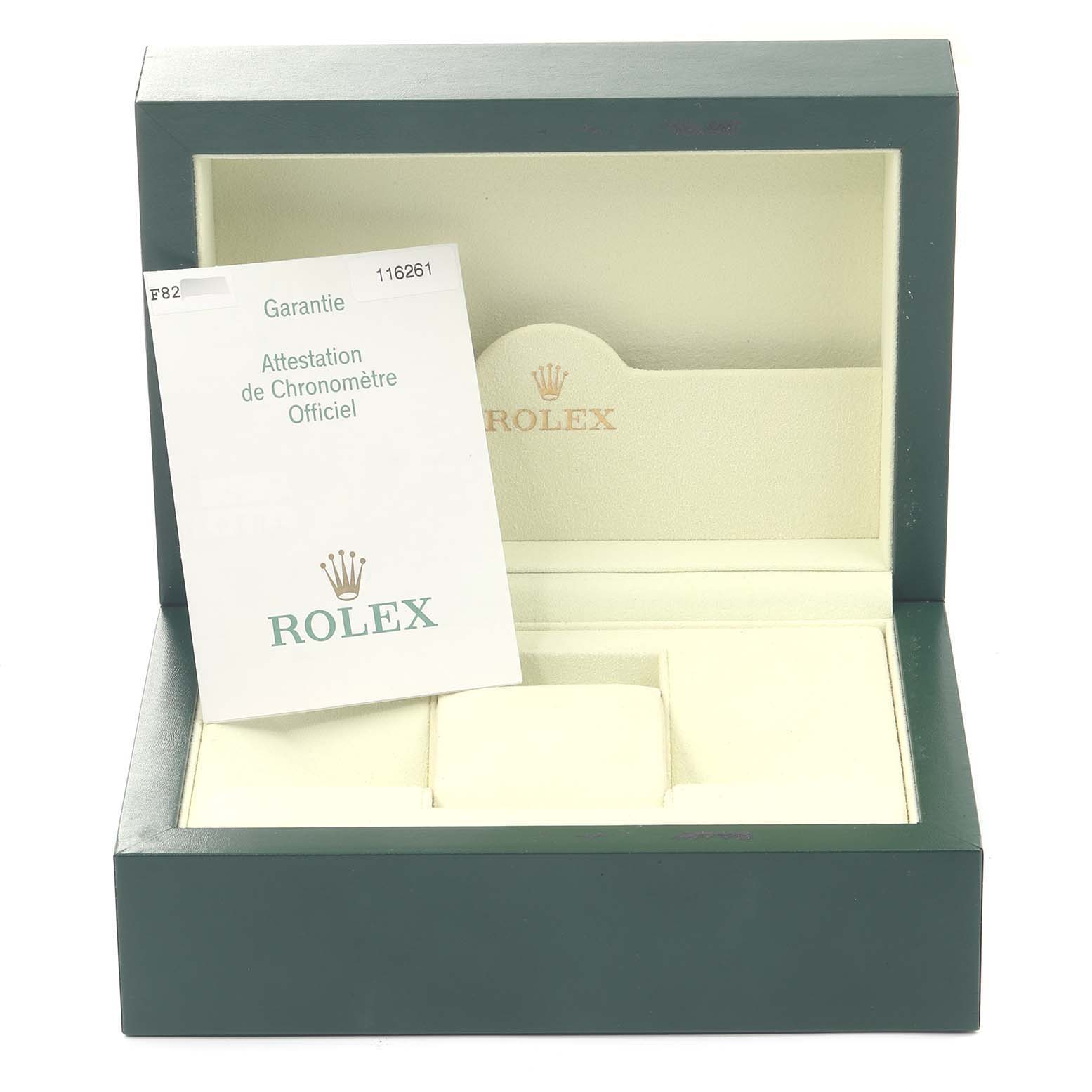 This image shows an empty green Rolex Turn-o-Graph 116261 Men
s Steel and Gold (two tone) White Dial 116261 Men
s Steel and Gold (two tone) White Dial watch box with a warranty card placed inside.