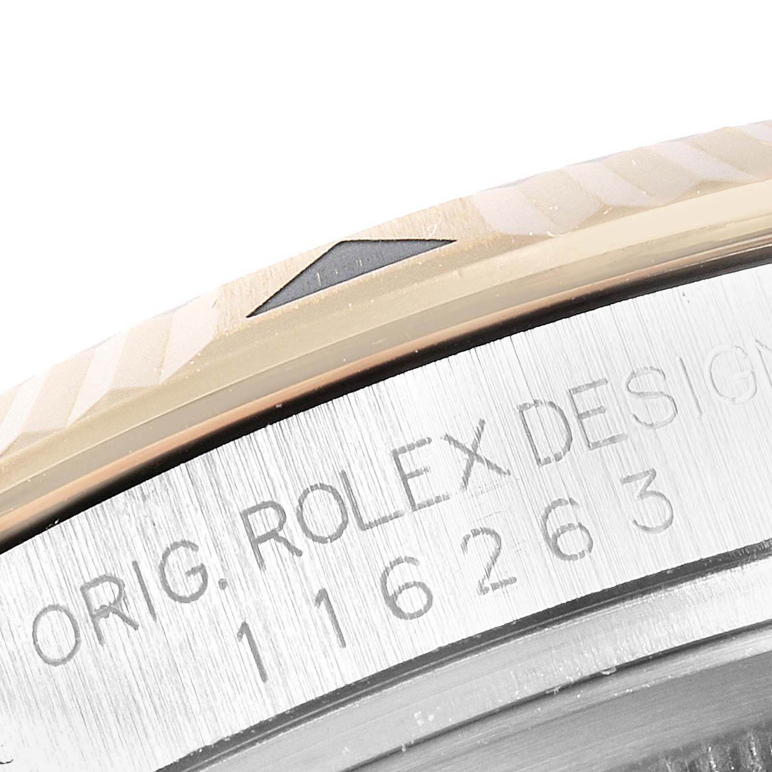 This image shows a close-up of the bezel and engraved serial number of a Rolex Turn-o-Graph 116263 Men's Steel and Gold (two tone) Grey Dial 116263 Men's Steel and Gold (two tone) Grey Dial watch.