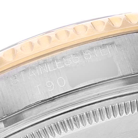 This close-up shows the side view of the bezel and part of the casing of a Rolex Yacht-Master 68623 Men
s Steel and Gold (two tone) Blue Dial 68623 Men
s Steel and Gold (two tone) Blue Dial watch.