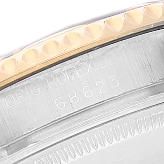 This close-up image shows the engraved bezel and side details of a Rolex Yacht-Master 68623 Men
s Steel and Gold (two tone) Blue Dial 68623 Men
s Steel and Gold (two tone) Blue Dial watch.