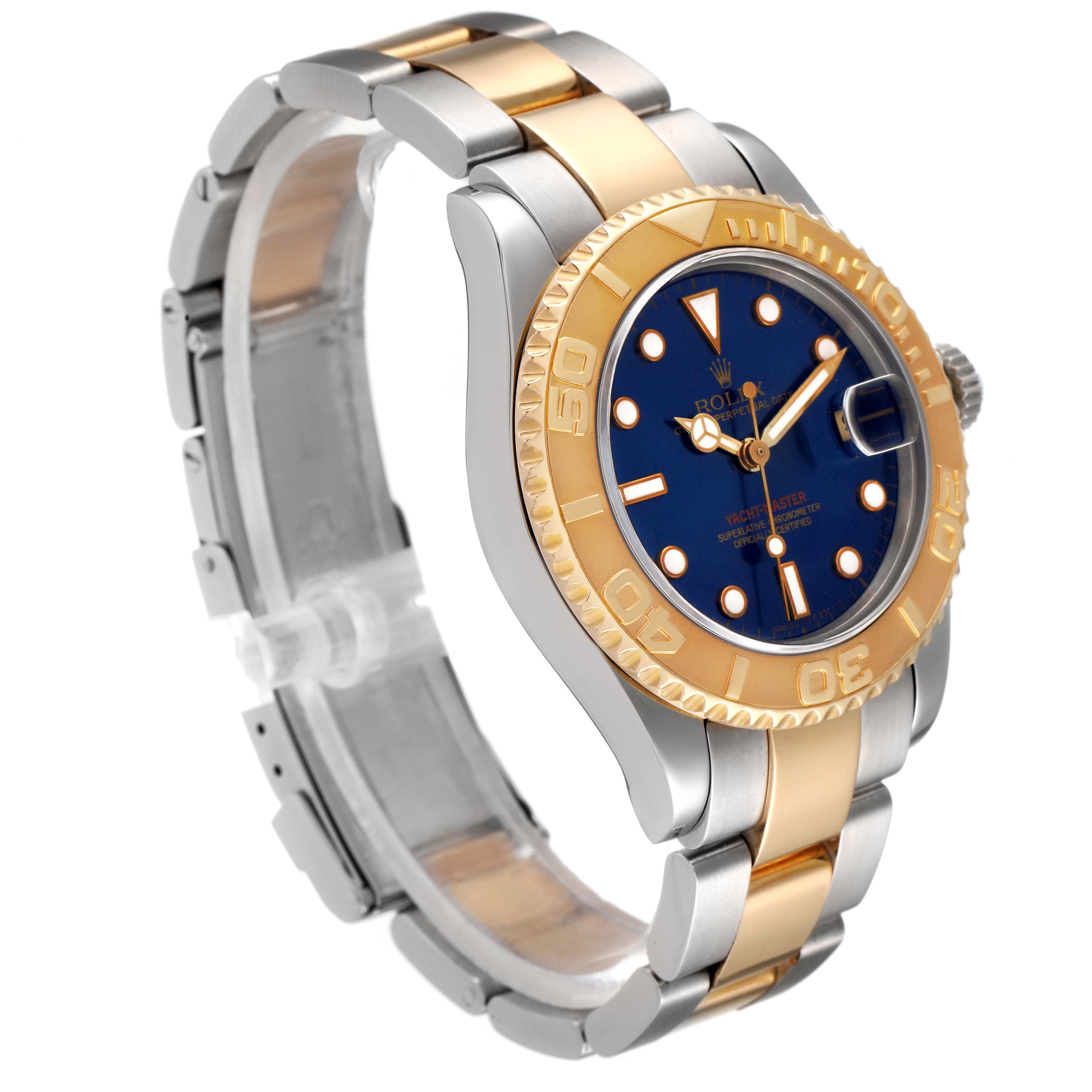 The Rolex Yacht-Master 68623 Men
s Steel and Gold (two tone) Blue Dial 68623 Men
s Steel and Gold (two tone) Blue Dial watch is shown at an oblique angle, displaying its two-tone bracelet, blue dial, and rotating bezel.
