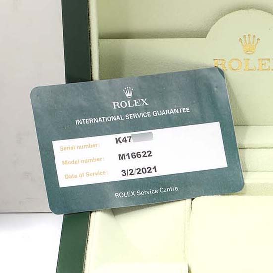 The image shows a Rolex Yacht-Master 16622 Men's Stainless Steel Silver Dial 16622 Men's Stainless Steel Silver Dial service guarantee card inside a Rolex box.
