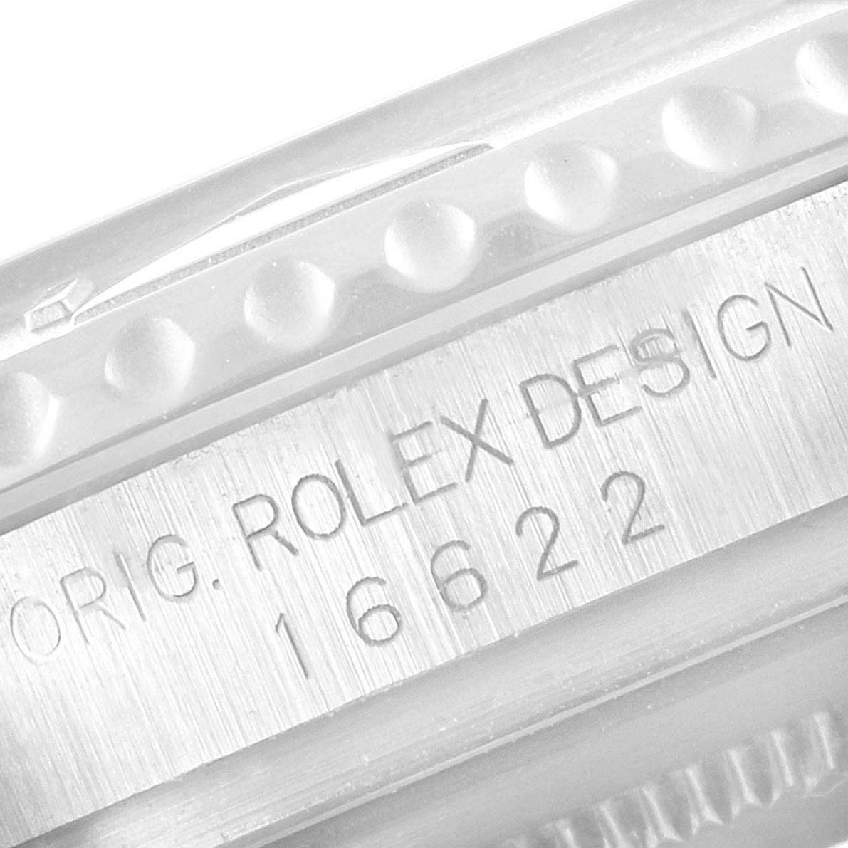 The image shows a close-up of the case back edge of a Rolex Yacht-Master 16622 Men's Stainless Steel Silver Dial 16622 Men's Stainless Steel Silver Dial watch, highlighting the engraved model number "16622."