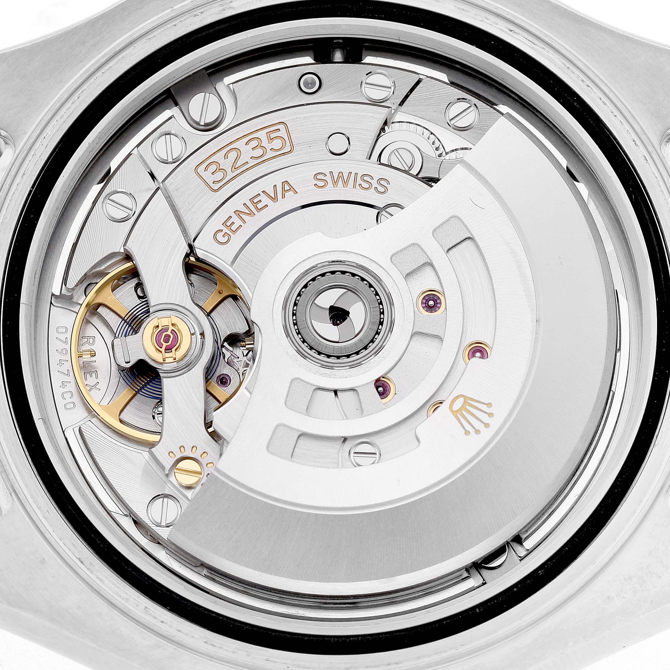 The image shows a close-up of the movement of a Rolex Yacht-Master 126621 Men's Stainless Steel Black Dial watch, highlighting the rotor and internal mechanics.