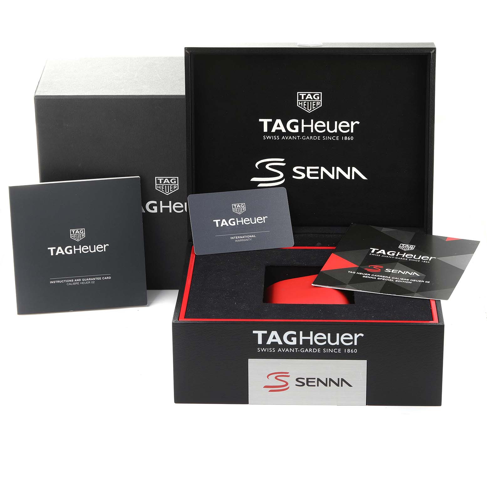 The image shows the packaging, instructions, and guarantee cards for the Carrera model by Tag Heuer.