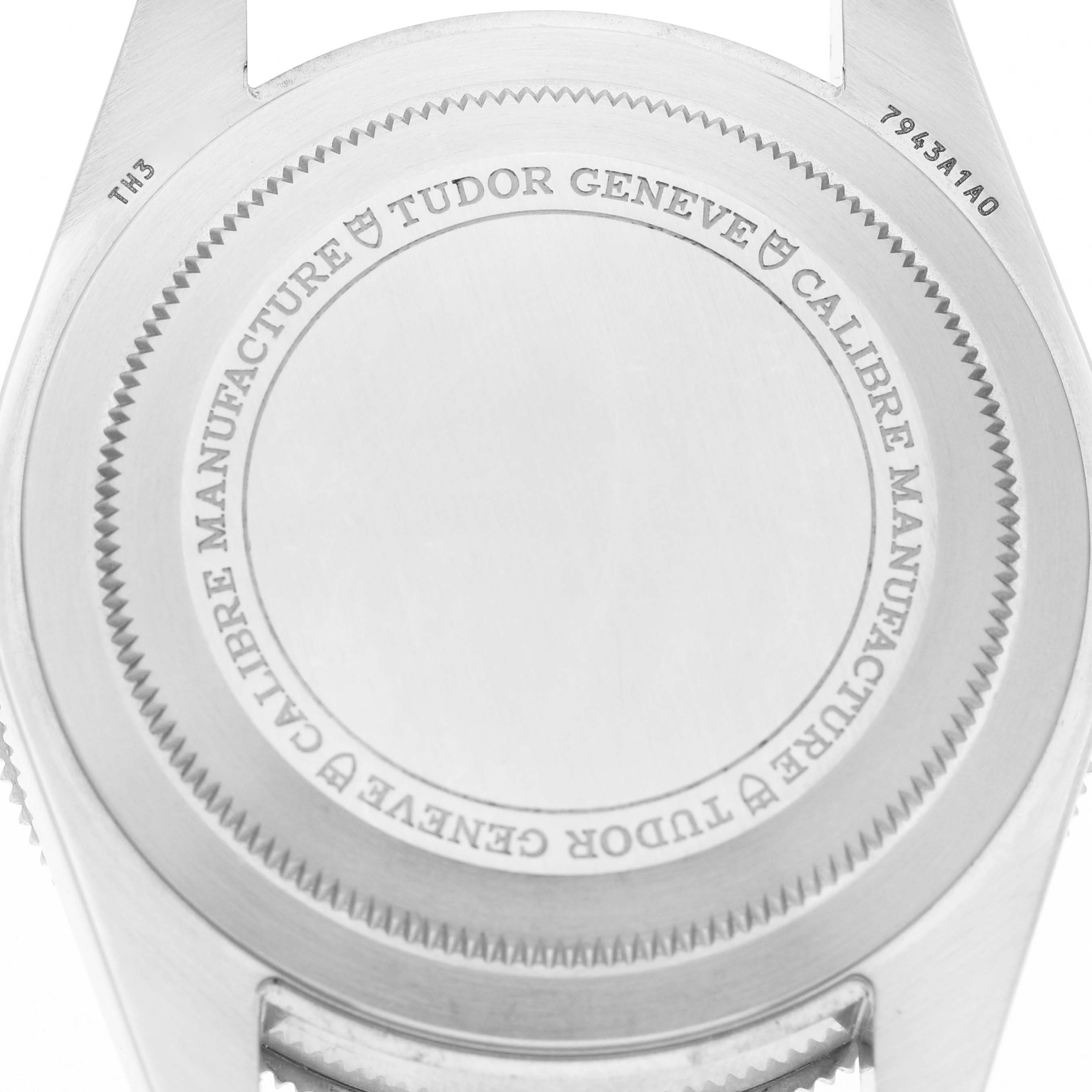 The image shows the case back of a Tudor Heritage Black Bay 7943A1A0NU Men's Stainless Steel Silver Dial, highlighting engravings and detailing.