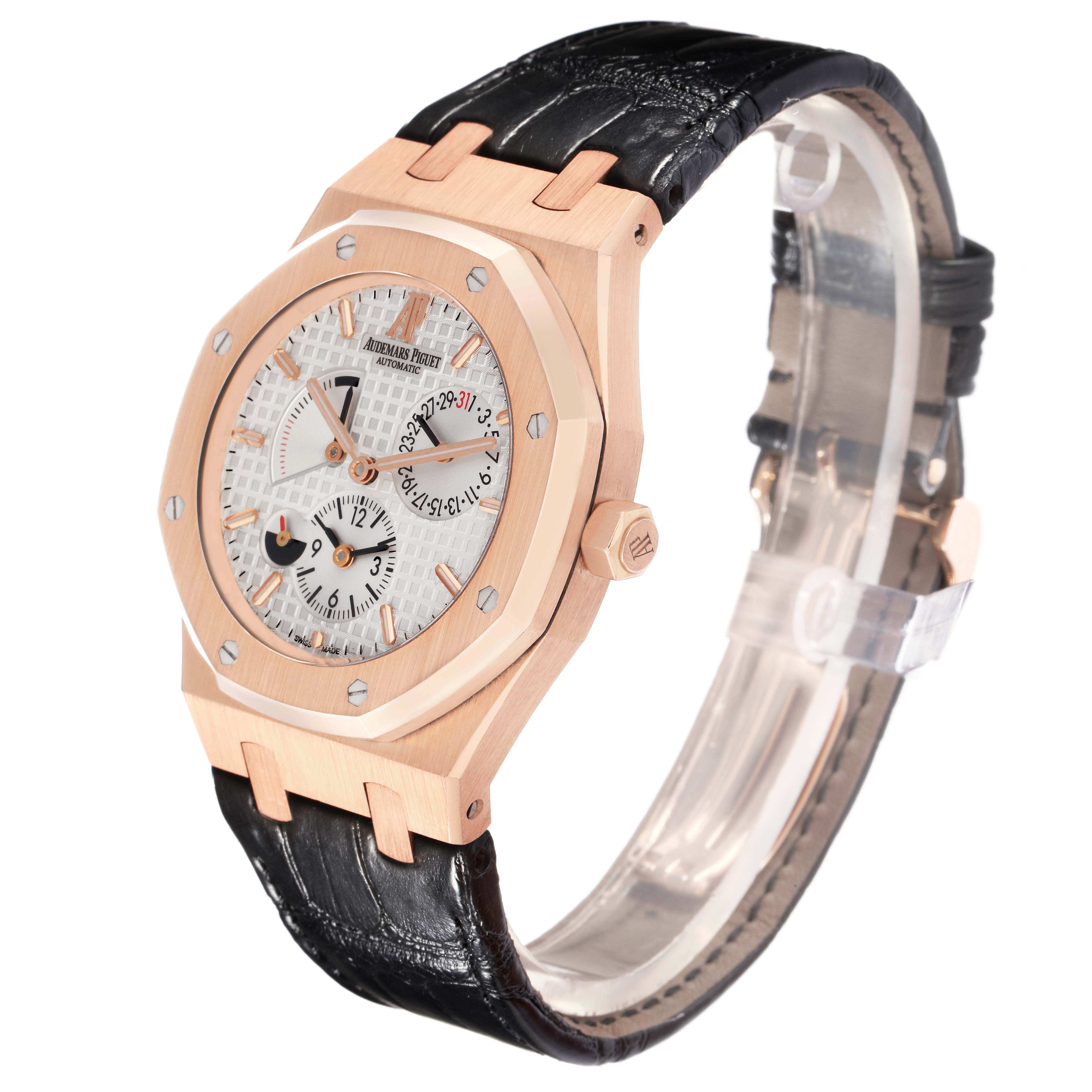The Audemars Piguet Royal Oak 26120OR.OO.D088CR.01 Men
s Rose Gold Silver Dial watch is shown at a three-quarter angle, highlighting the case, dial, crown, bezel, and strap.