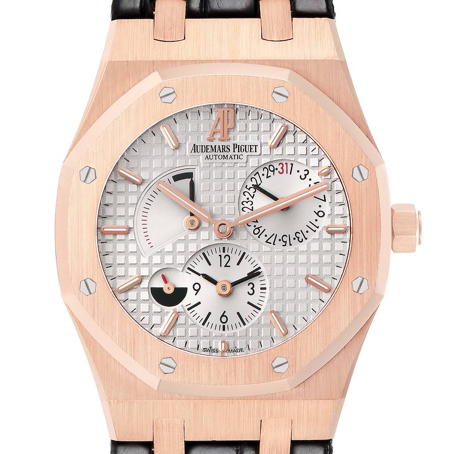 The Audemars Piguet Royal Oak watch is shown from a front angle, featuring the dial, bezel, and part of the strap.