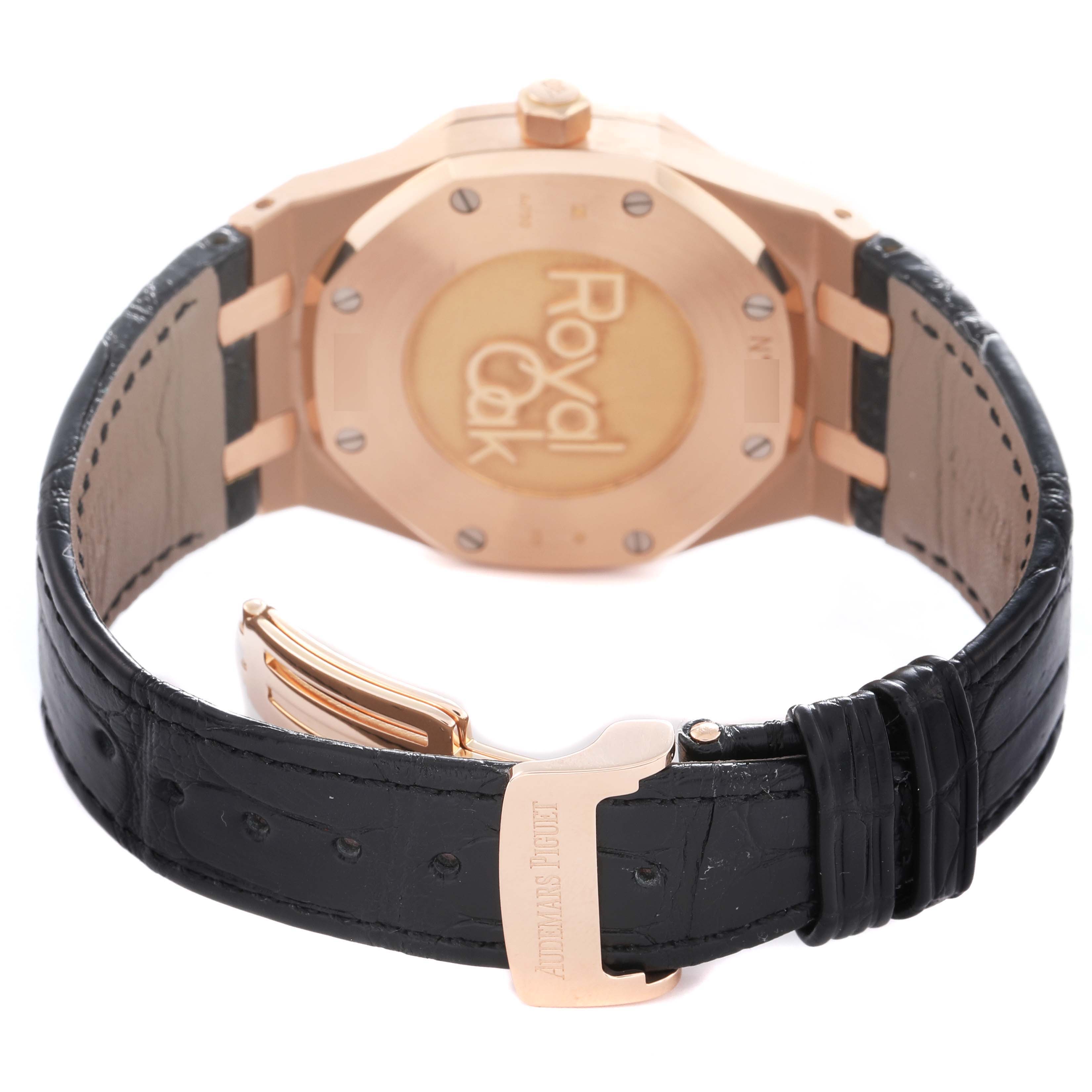 The image shows the back of a Royal Oak by Audemars Piguet, highlighting the case back and black leather strap with buckle.