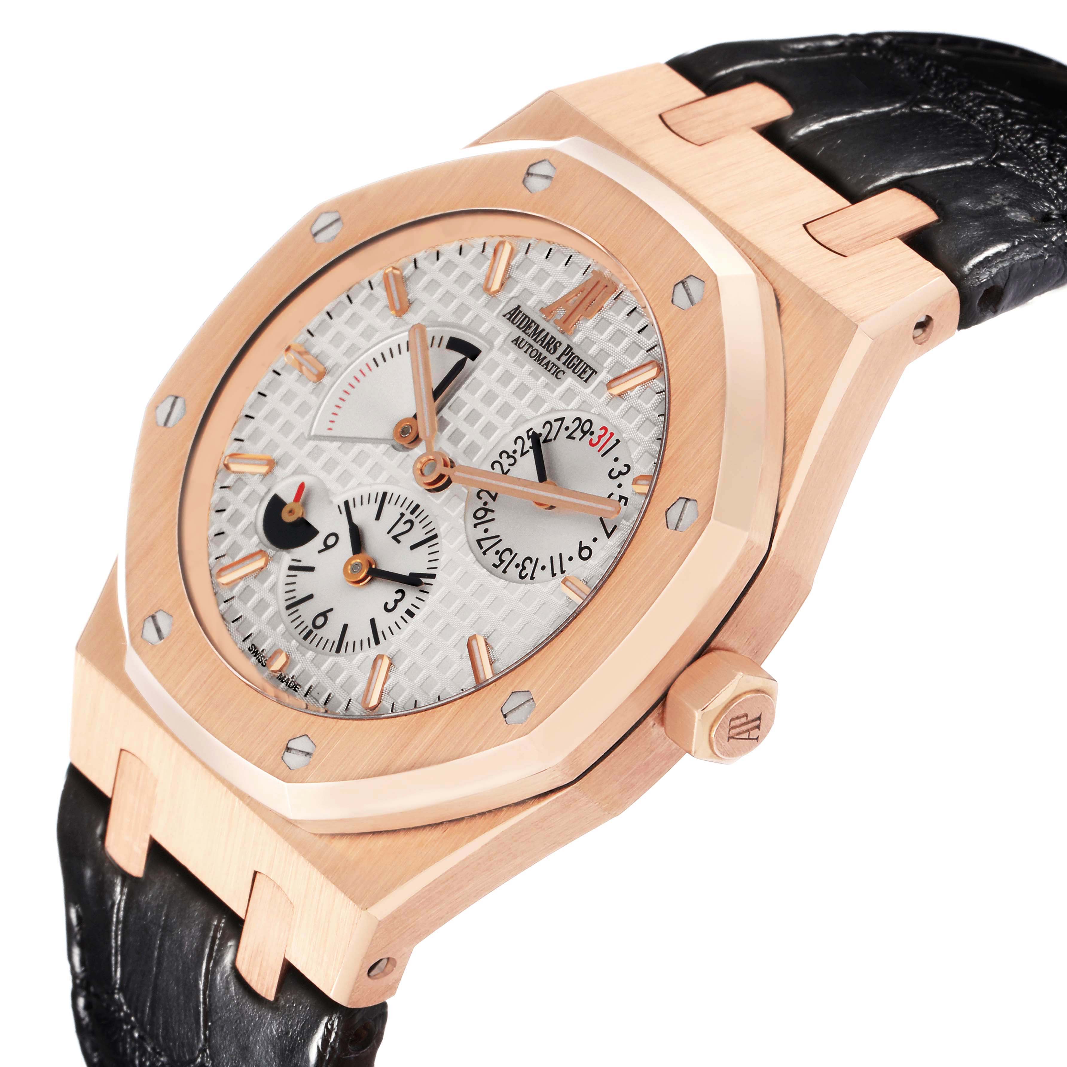 The Audemars Piguet Royal Oak 26120OR.OO.D088CR.01 Men
s Rose Gold Silver Dial watch is shown at an angled close-up, highlighting the case, dial, crown, and leather strap.