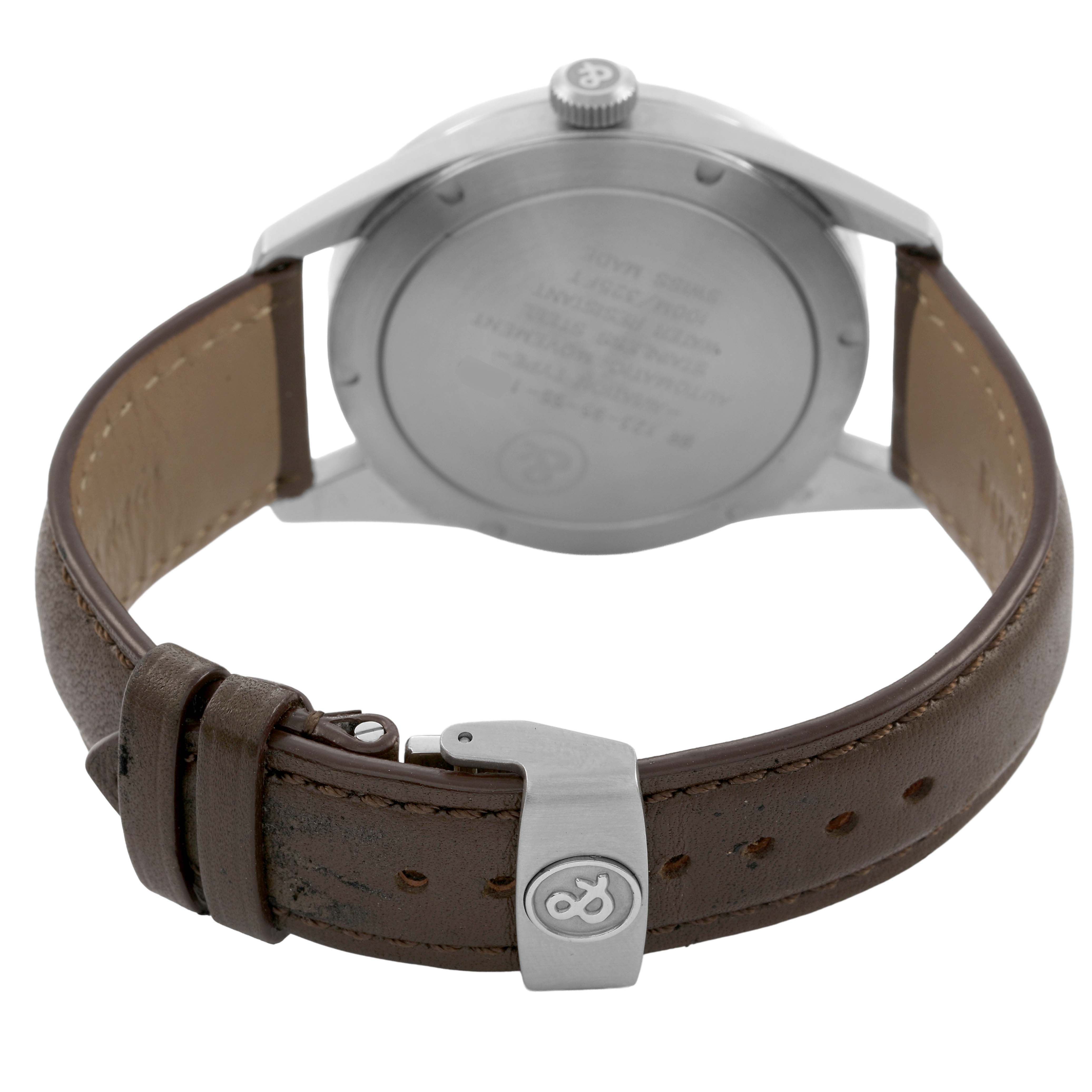 The image shows the back of a Bell & Ross Vintage BR123 Men's Stainless Steel Beige Dial watch, displaying the case back and brown leather strap with a clasp.