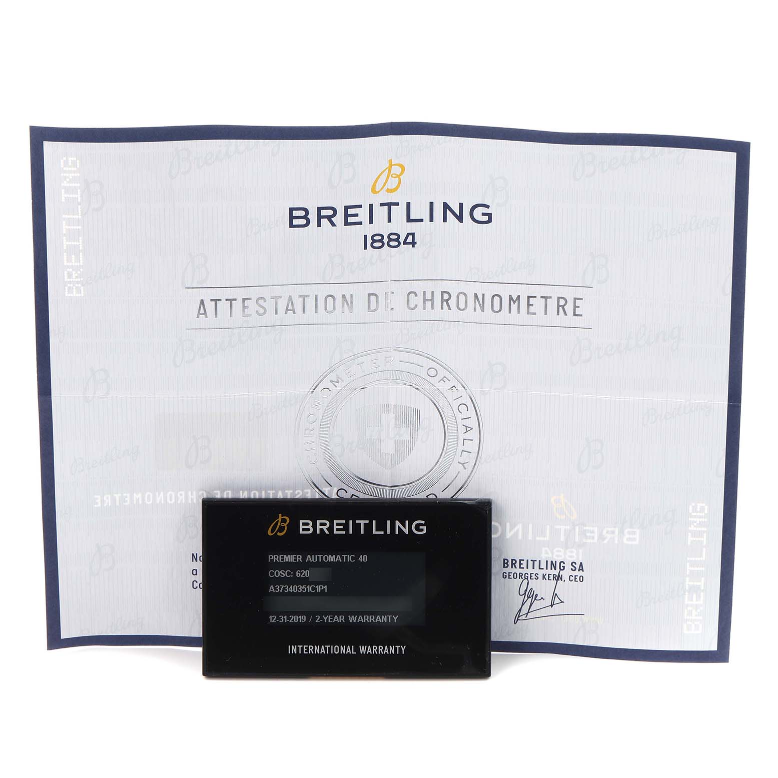 The image shows a Breitling Premier A37340351C1P1 Men
s Stainless Steel Blue Dial A37340351C1P1 Men
s Stainless Steel Blue Dial model
s international warranty card and chronometer certificate from a front angle.