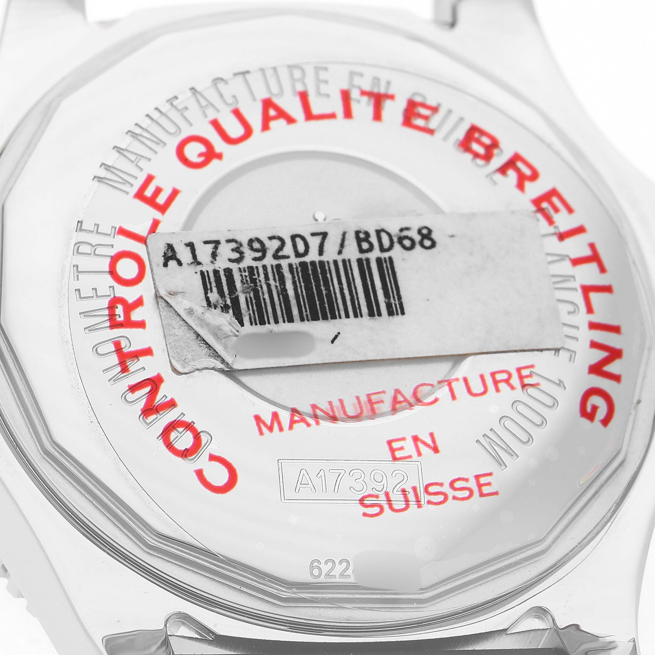 The image shows the back of a Breitling Superocean A17365 Men's Stainless Steel Black Dial watch with quality control markings and a barcode sticker.