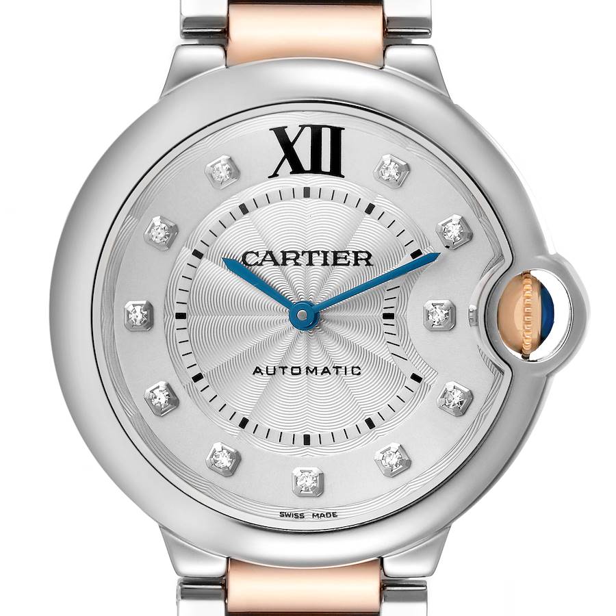 The Cartier Ballon Bleu watch is shown from a front angle, highlighting its dial, Roman numeral XII, blue hands, and crown with sapphire.