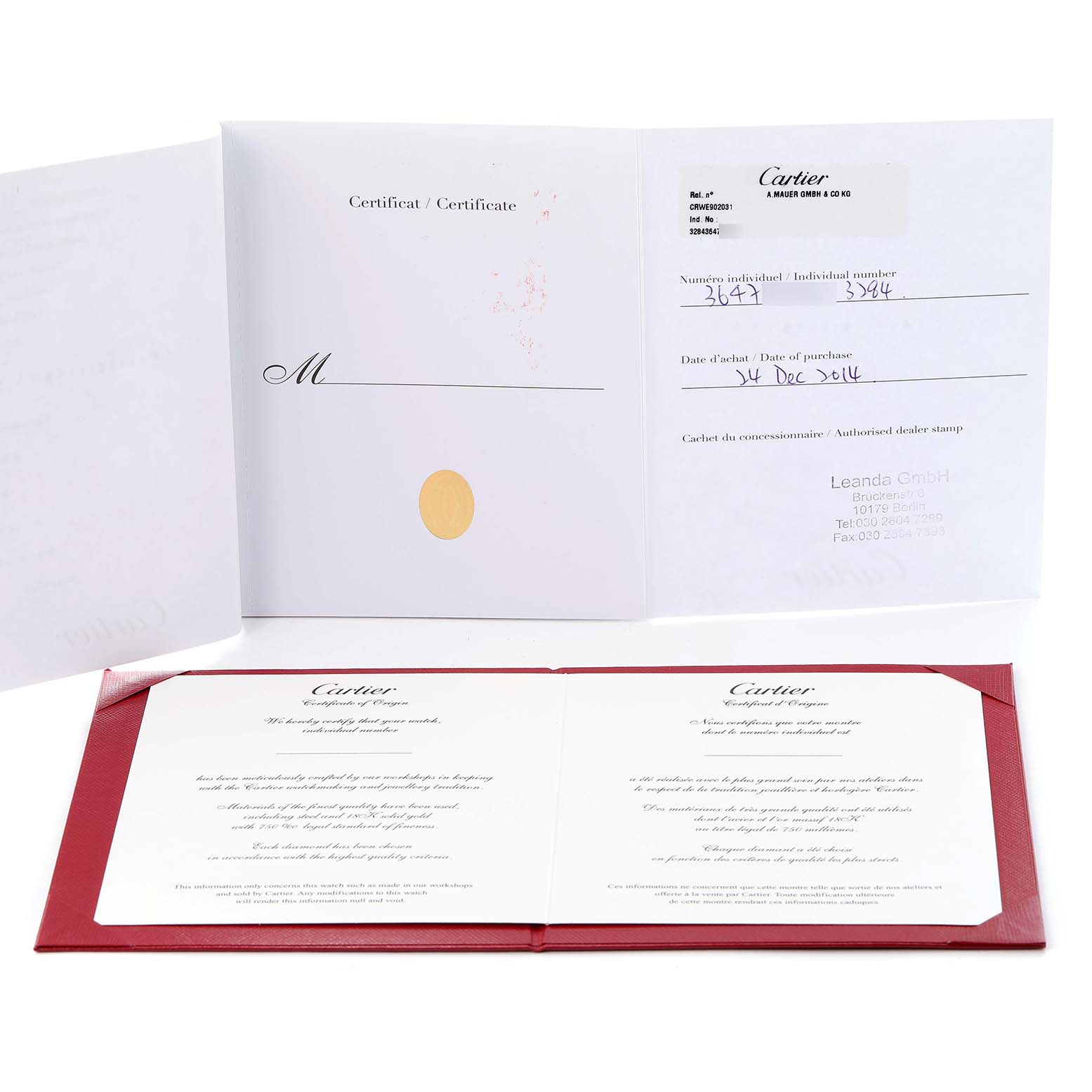 The image shows documentation and certificates for the Cartier Ballon Bleu W3BB0018 Men
s Steel and Gold (two tone) Silver Dial W3BB0018 Men
s Steel and Gold (two tone) Silver Dial watch, displayed open and angled slightly from above.