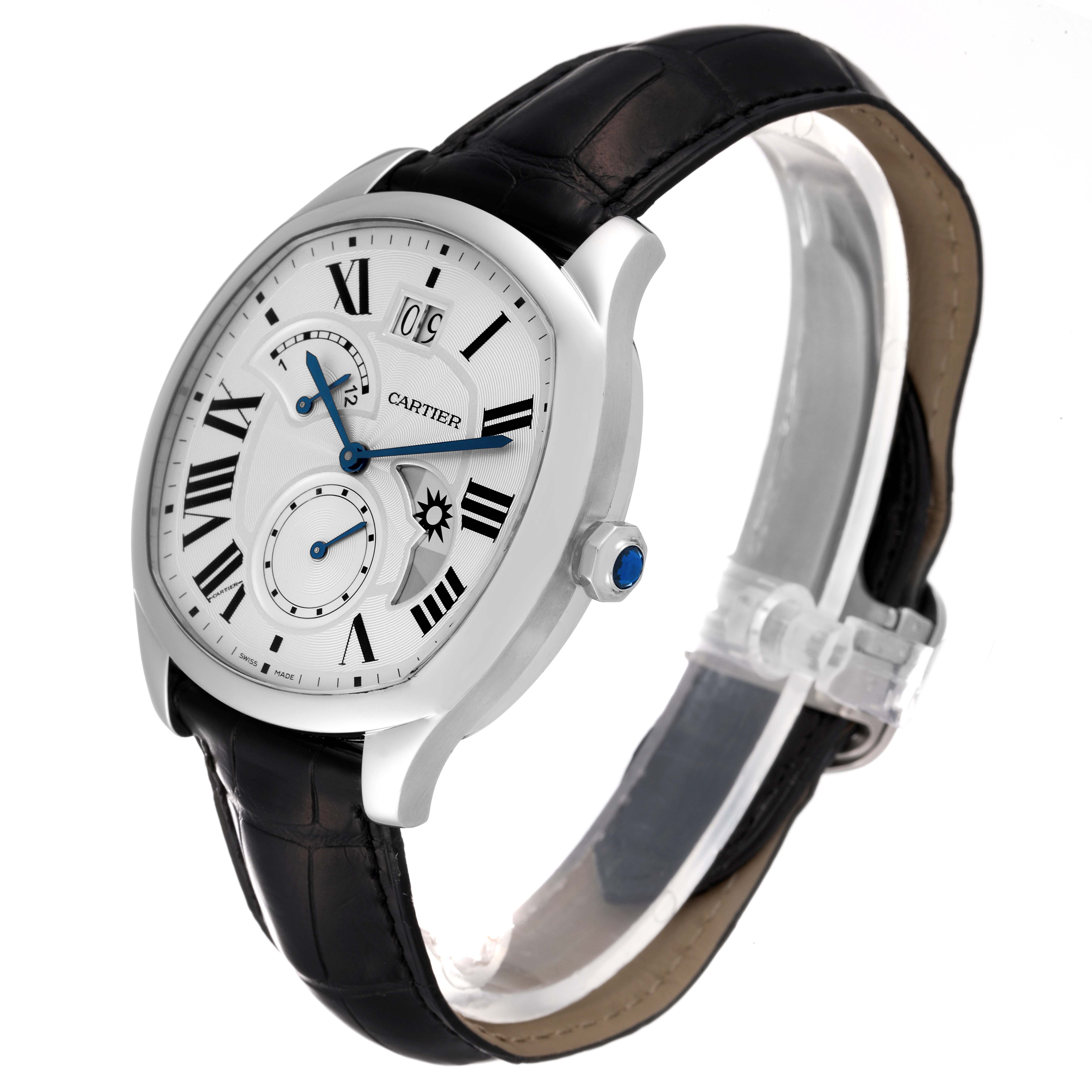 The Drive de Cartier watch by Cartier is shown at an angle displaying its face, silver case, black leather strap, and crown with a blue gemstone.