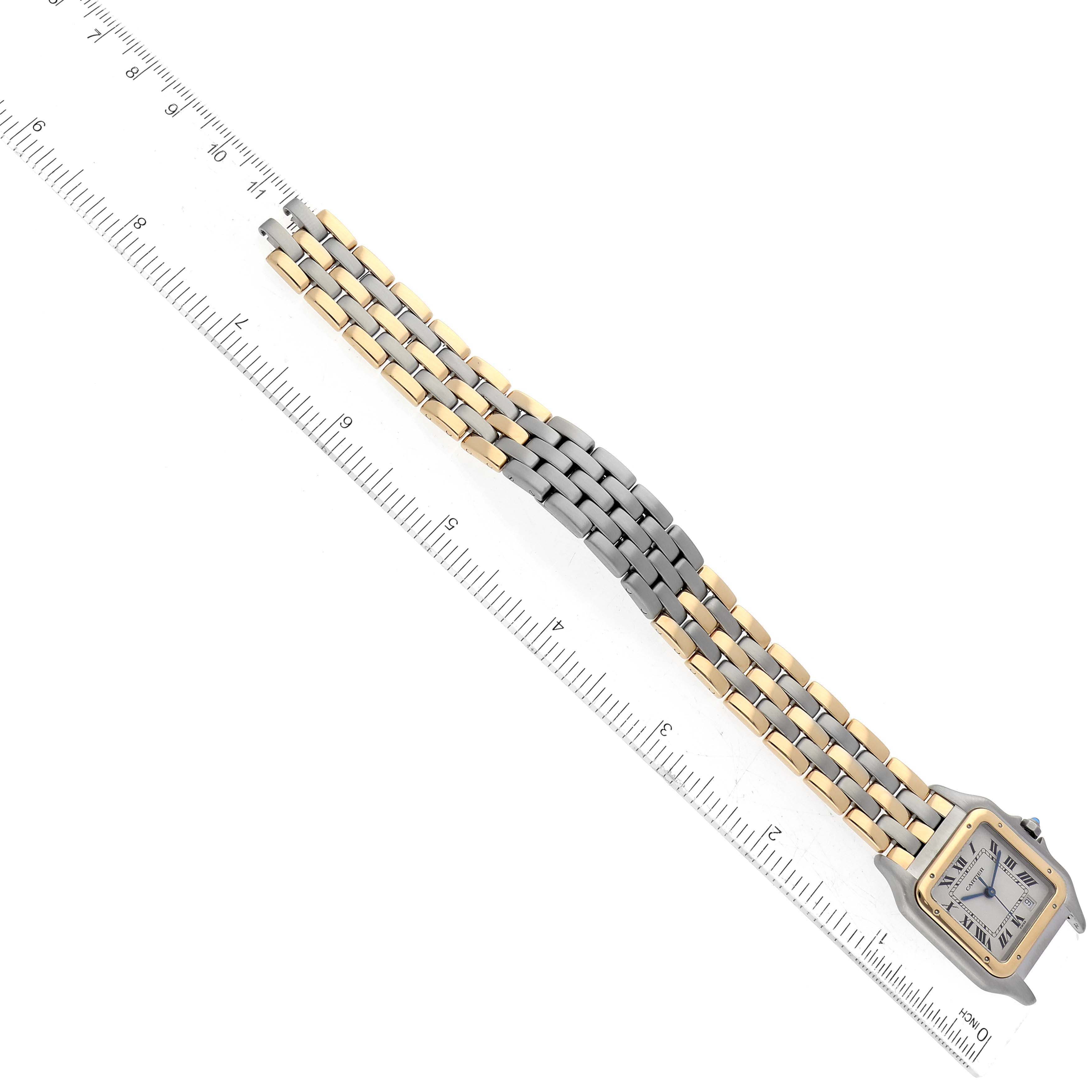 The image shows a top-down view of a Cartier Panthere W25028B8 Women's Steel and Gold (two tone) Silver Dial W25028B8 Women's Steel and Gold (two tone) Silver Dial watch, highlighting its two-tone bracelet and square face.