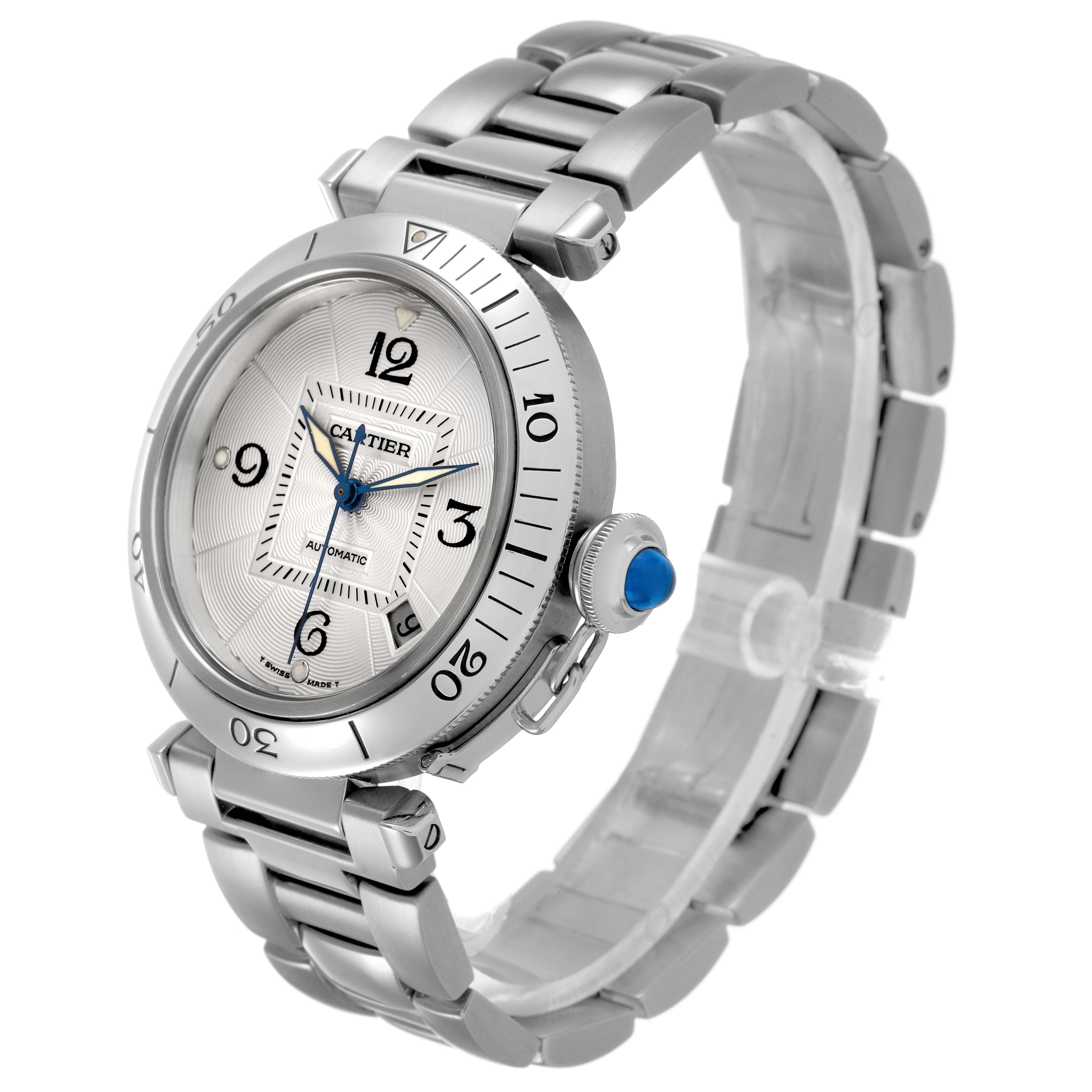 The Cartier Pasha W31059H3 Men's Stainless Steel Silver Dial watch is shown at an angle displaying its face, bezel, crown, and bracelet.