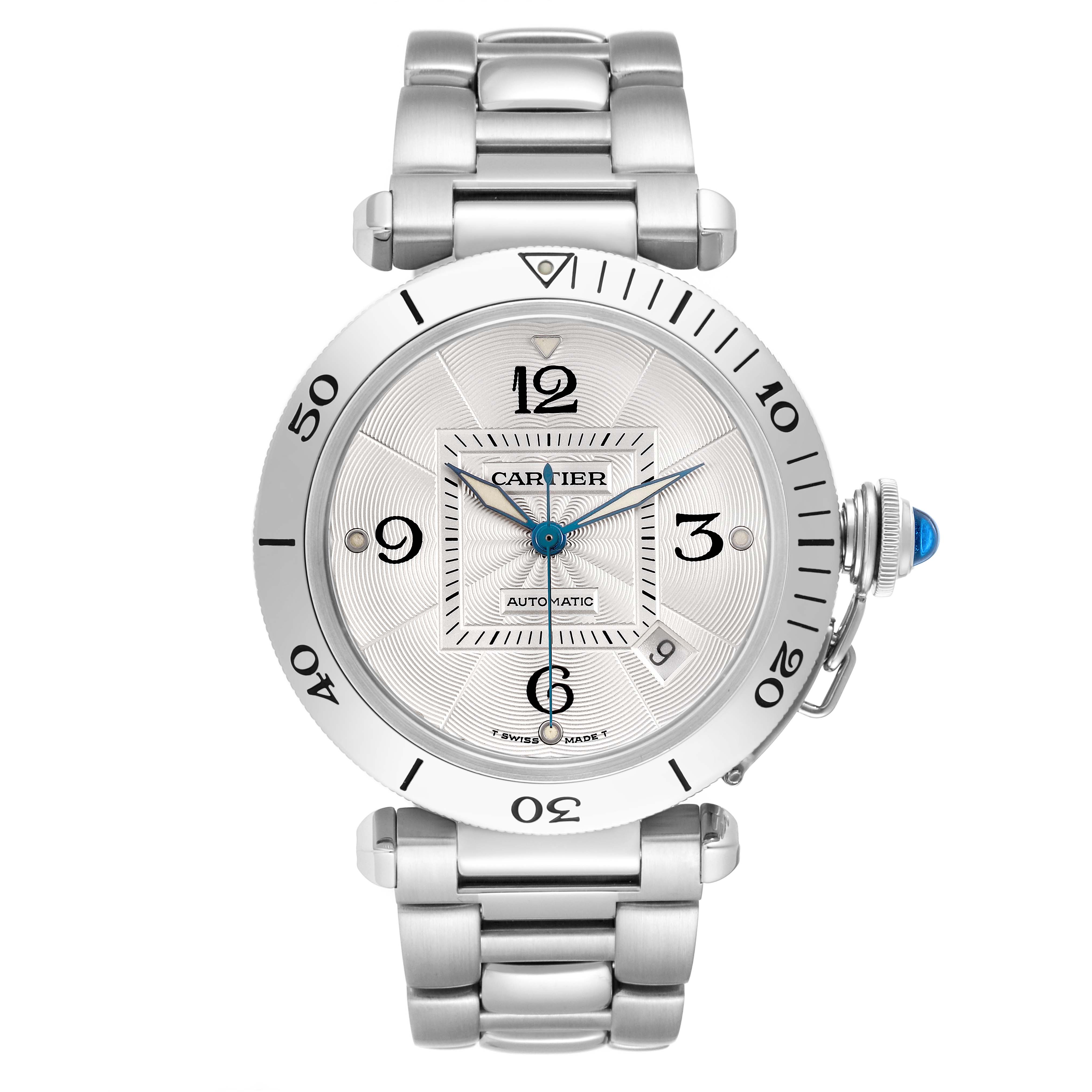 The Cartier Pasha W31059H3 Men's Stainless Steel Silver Dial watch is shown from a front angle, displaying the dial, bezel, crown with blue cabochon, and metal bracelet.