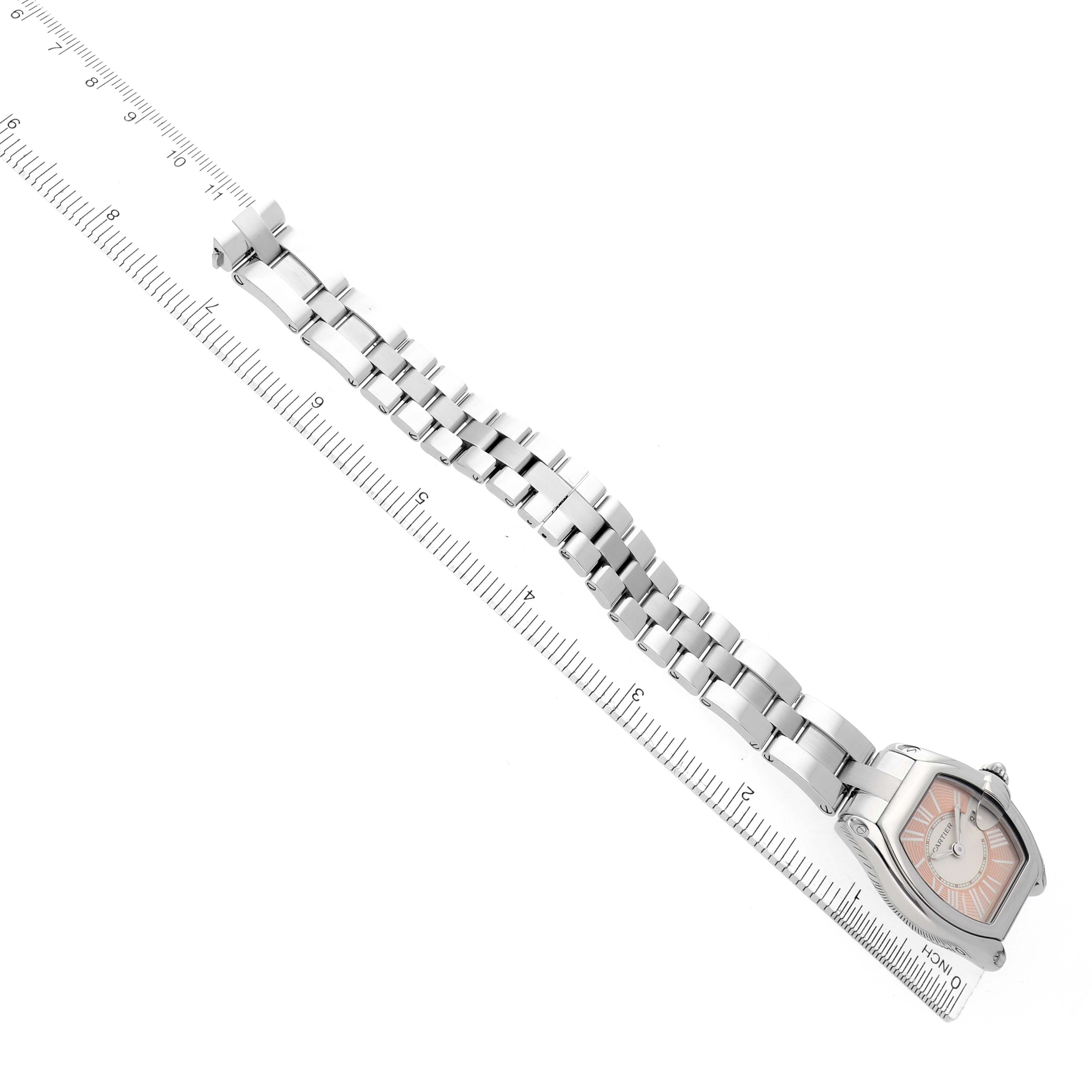 The Cartier Roadster W62054V3 Women
s Stainless Steel Pink Dial W62054V3 Women
s Stainless Steel Pink Dial watch is displayed flat at an angle, showing the full bracelet and face.