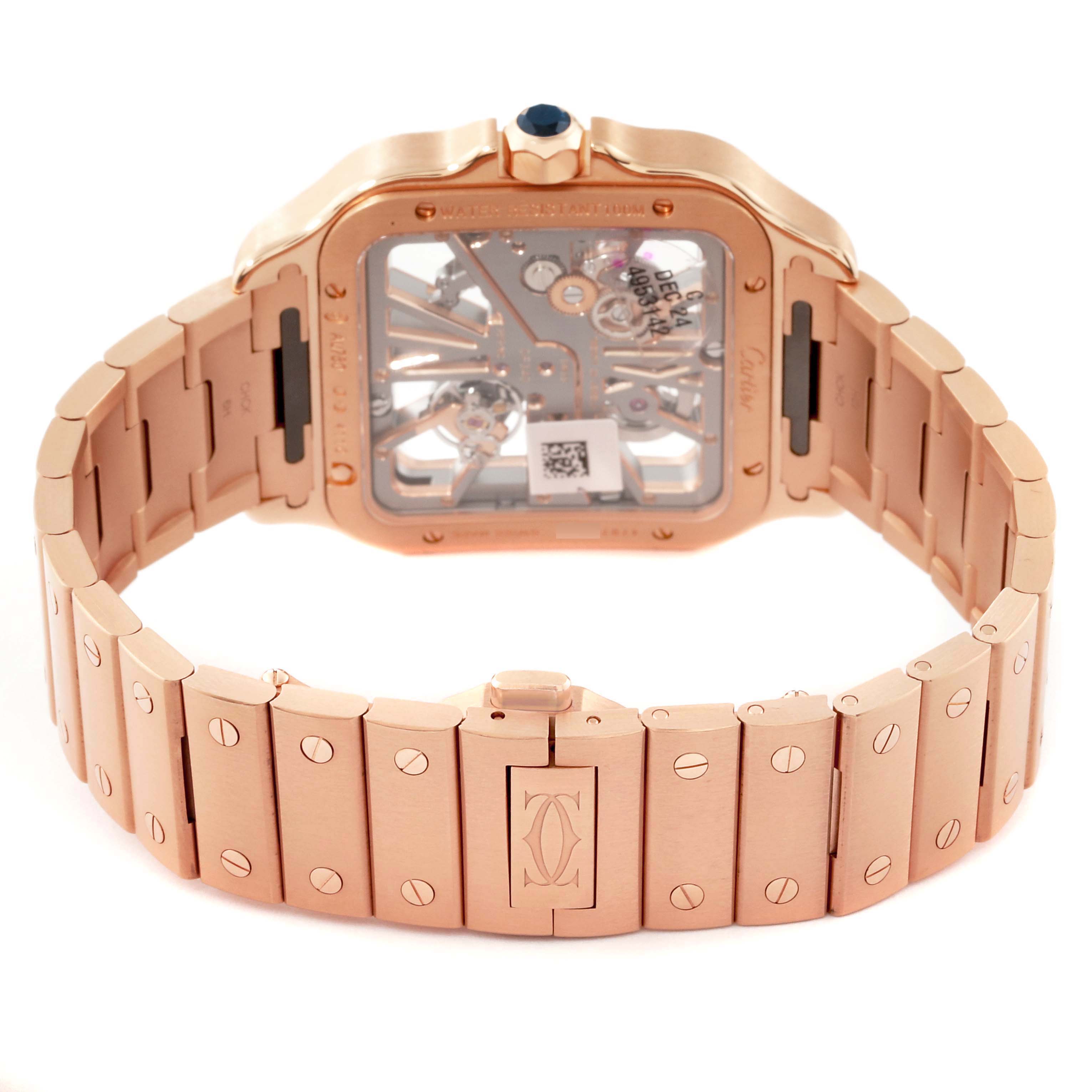 This image shows the back and bracelet of the Santos model watch by Cartier, highlighting the movement and clasp.