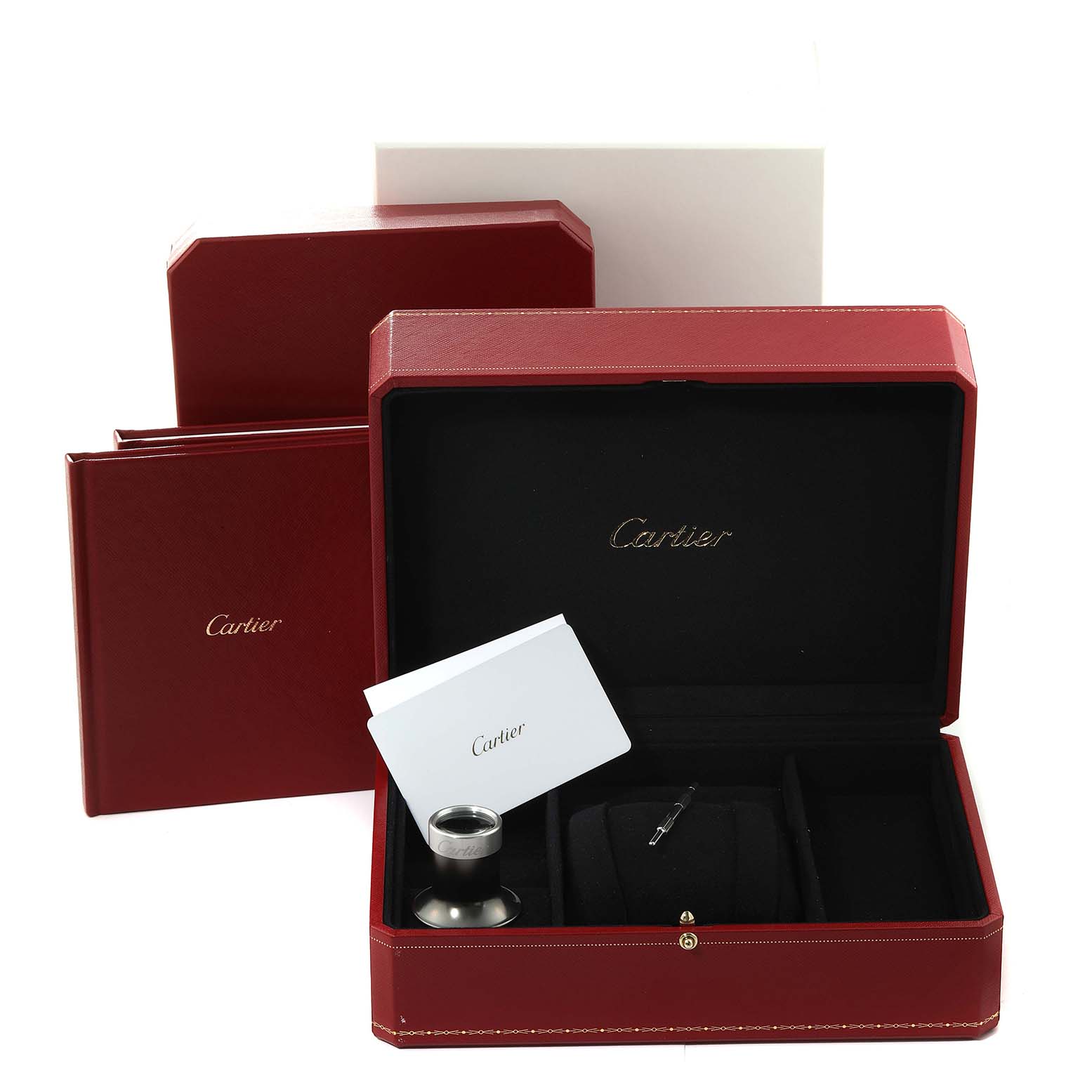 The image shows an open Cartier Santos WHSA0016 Men's Rose Gold Transparent Dial WHSA0016 Men's Rose Gold Transparent Dial watch box with compartments, a loupe, and documentation.