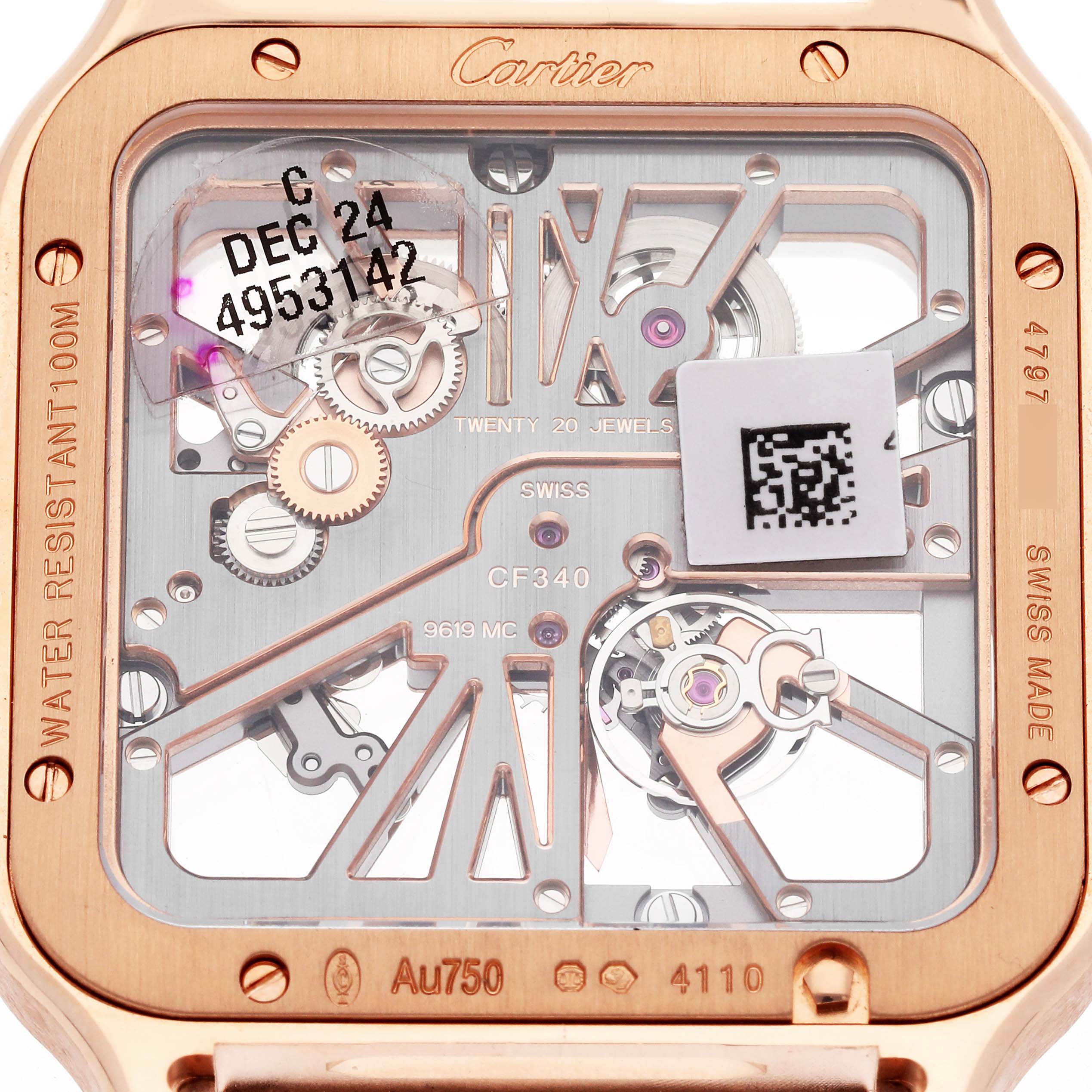 This close-up image of a Cartier Santos WHSA0016 Men's Rose Gold Transparent Dial WHSA0016 Men's Rose Gold Transparent Dial model showcases the intricate mechanisms and engravings on the watch's back.