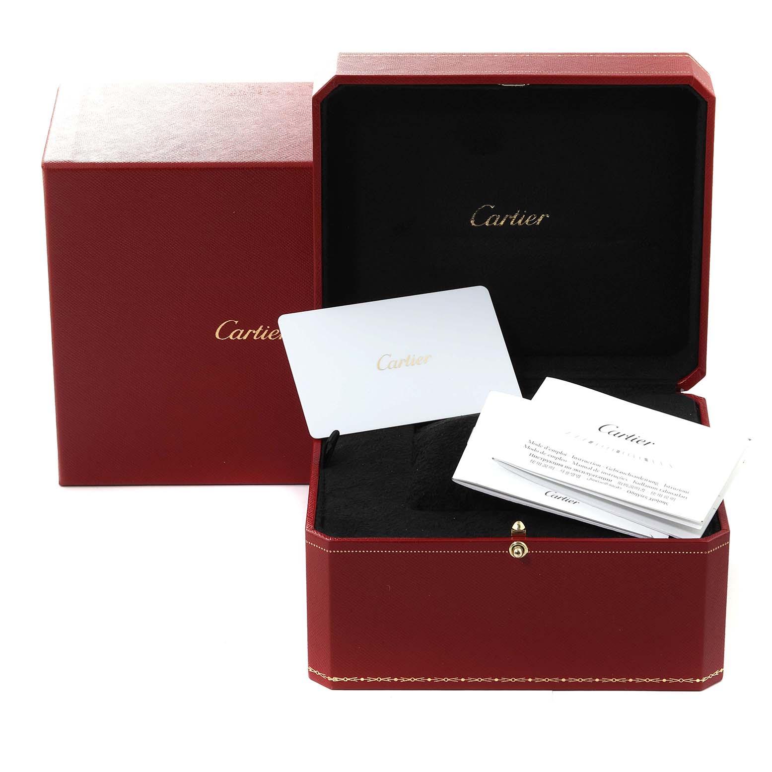 This image shows the box and accessories of a Santos Dumont watch by Cartier, including the case, booklets, and warranty card.