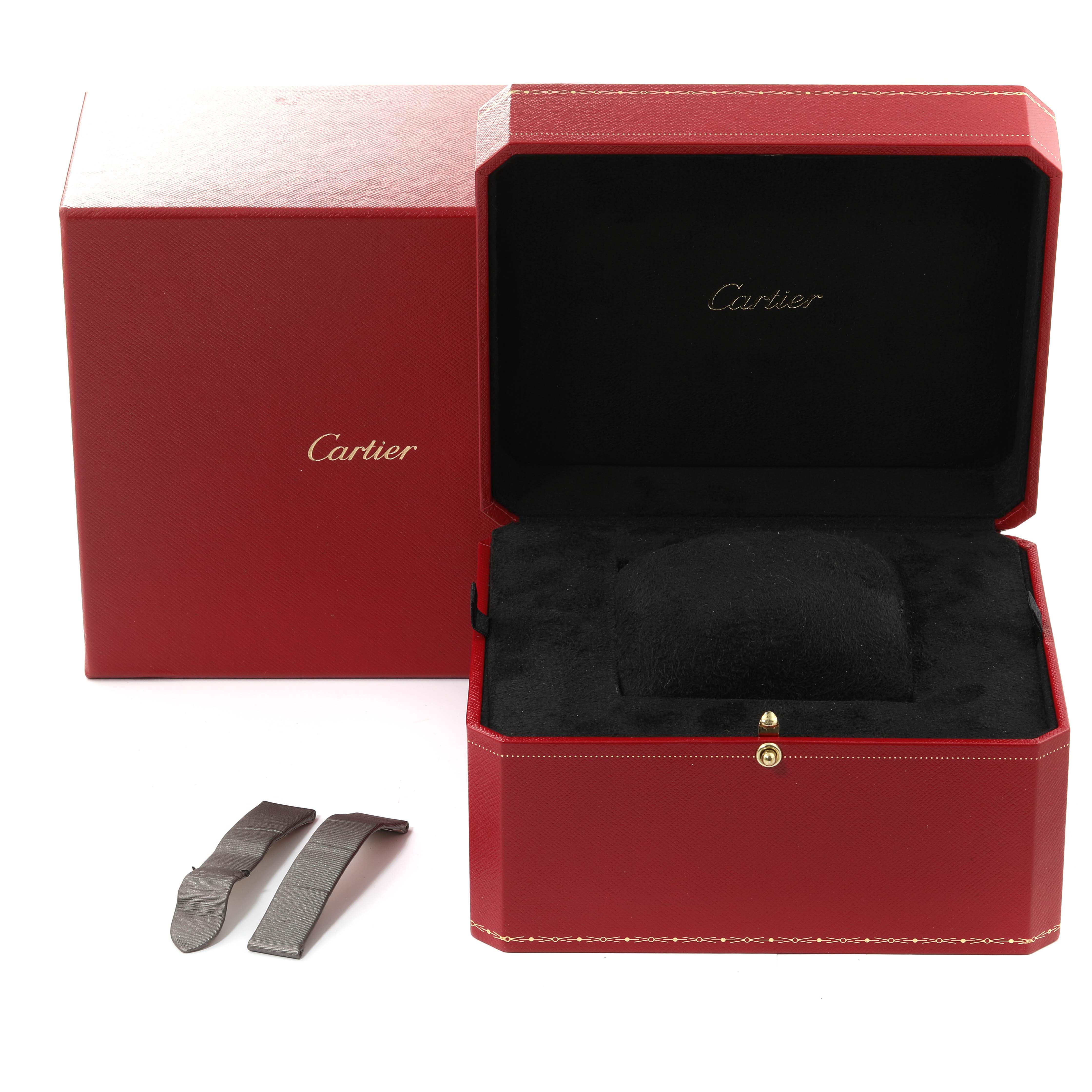 The image shows a red Cartier box for the Tank Francaise model, an outer box, and two metal watch parts.