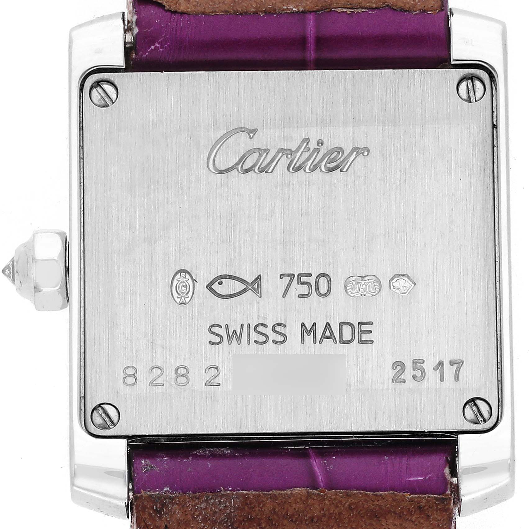 The image shows the back side of a Cartier Tank Francaise WE102631 Women
s White Gold Silver Dial WE102631 Women
s White Gold Silver Dial watch, highlighting the branding, serial number, and Swiss-made details.
