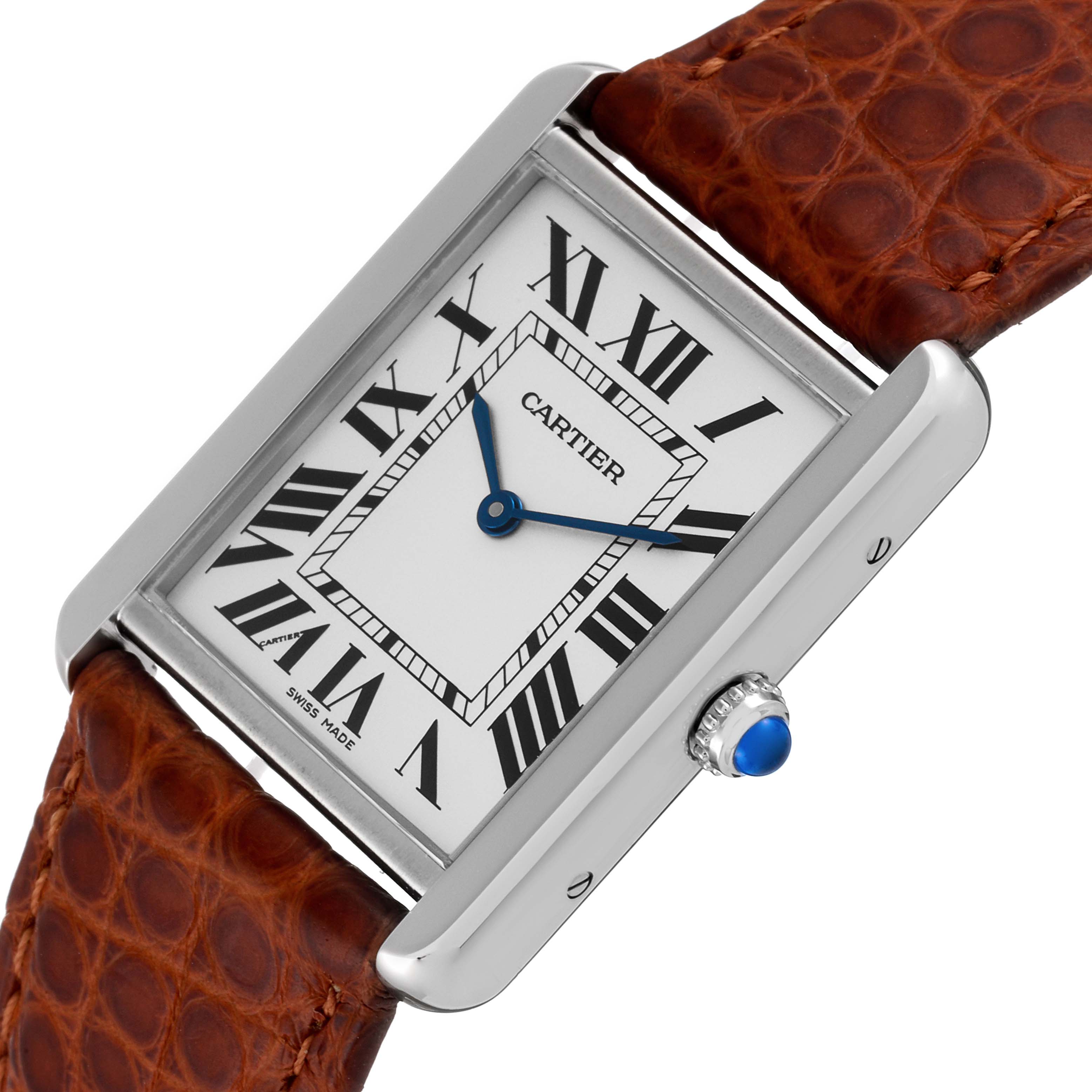 The image shows a Cartier Tank Solo W1018355 Men's Stainless Steel Silver Dial W1018355 Men's Stainless Steel Silver Dial watch face and crown at an angled close-up, highlighting its Roman numeral dial and brown leather strap.
