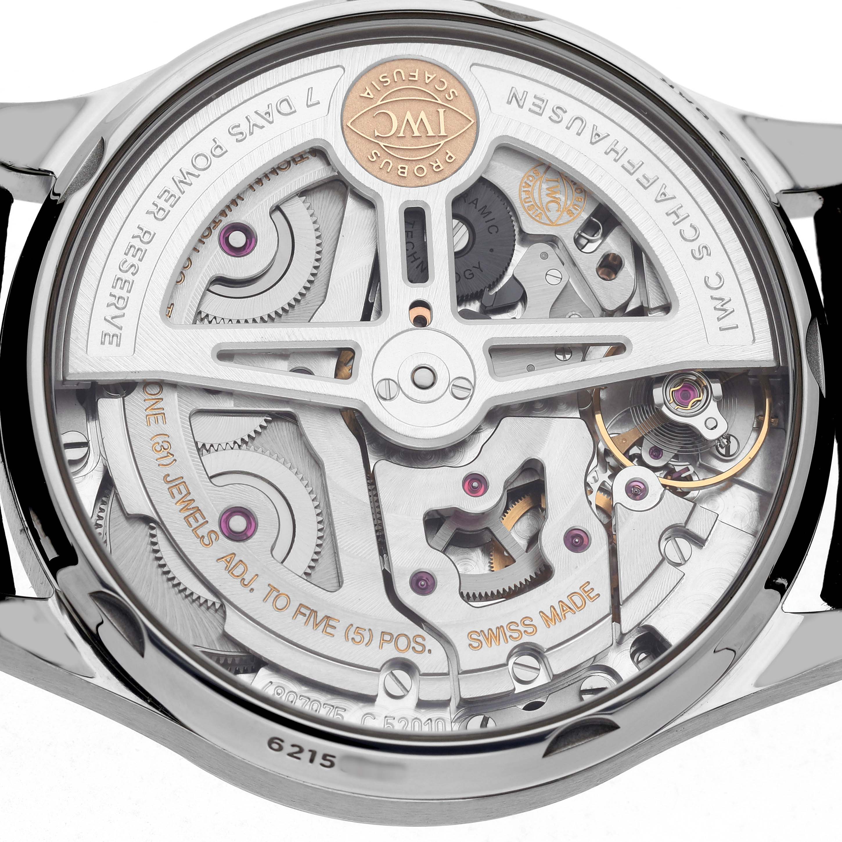 The image displays the movement of an IWC Portuguese IW500710 Men's Stainless Steel Blue Dial watch from the back, showcasing its intricate mechanics and rotor.