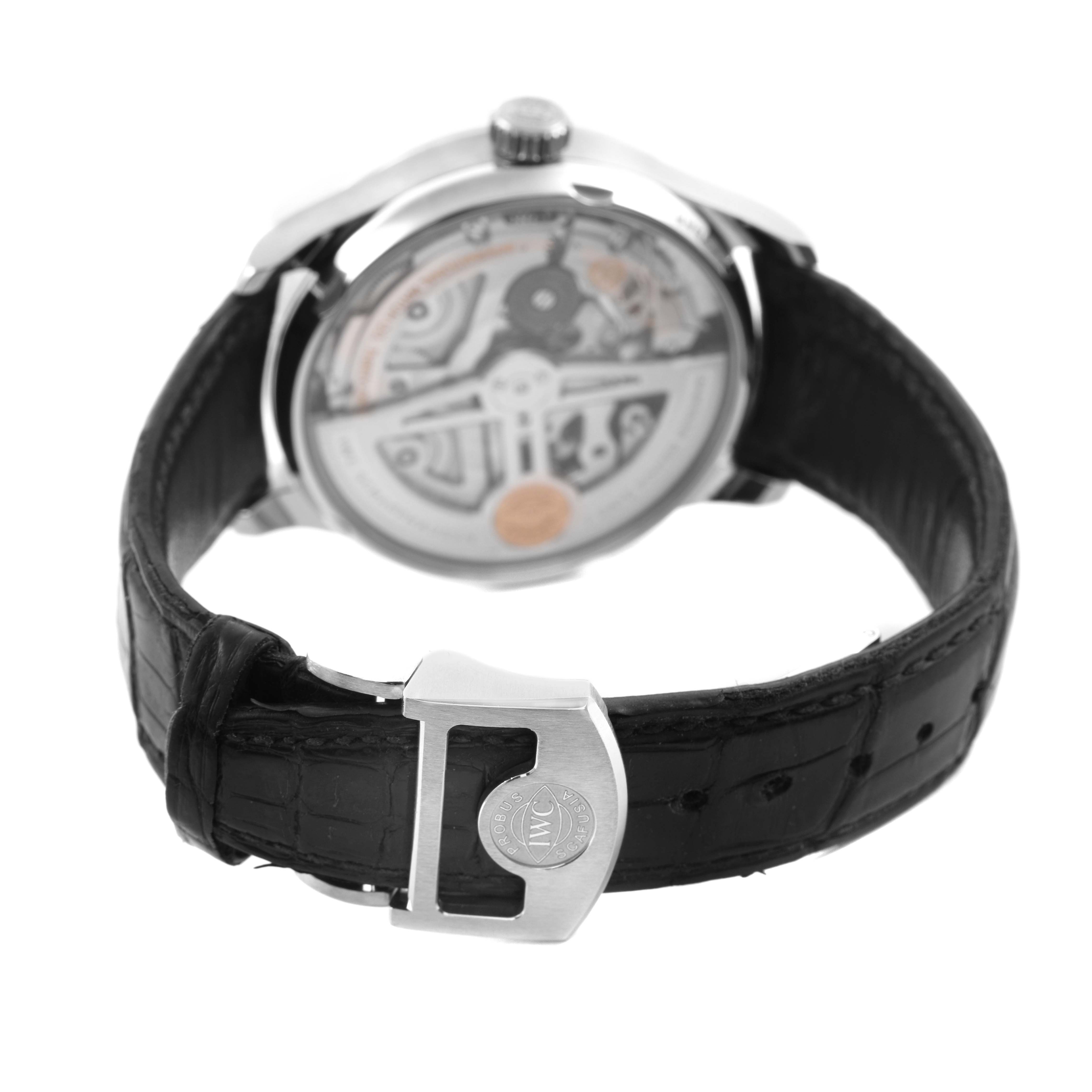 The IWC Portuguese IW500710 Men's Stainless Steel Blue Dial watch is shown from the rear, highlighting the case back and clasp of the leather strap.