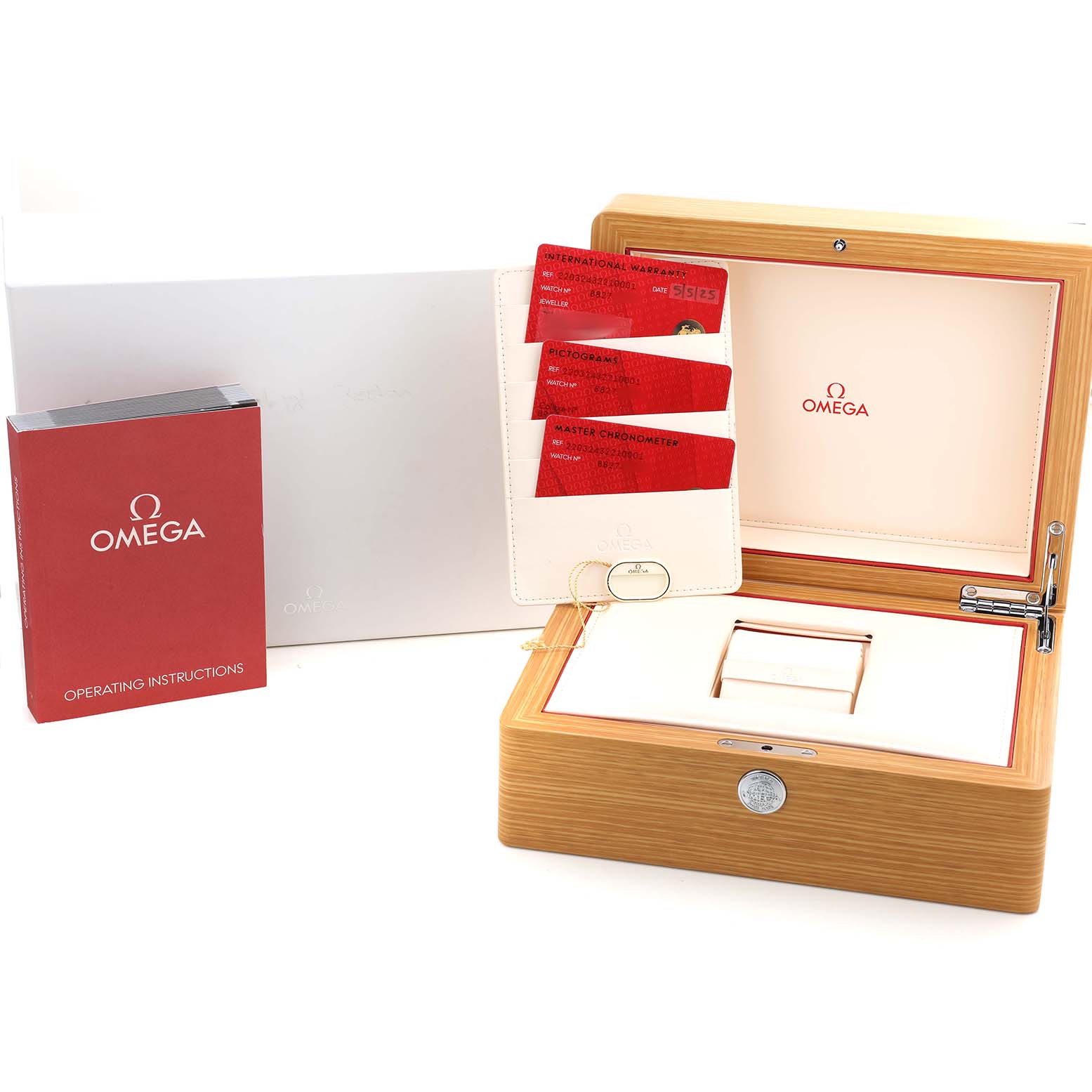 The Omega Seamaster 220.32.43.22.10.001 Men's Stainless Steel Green Dial accessories include a wooden watch box, warranty cards, a cardholder, and an operating manual.
