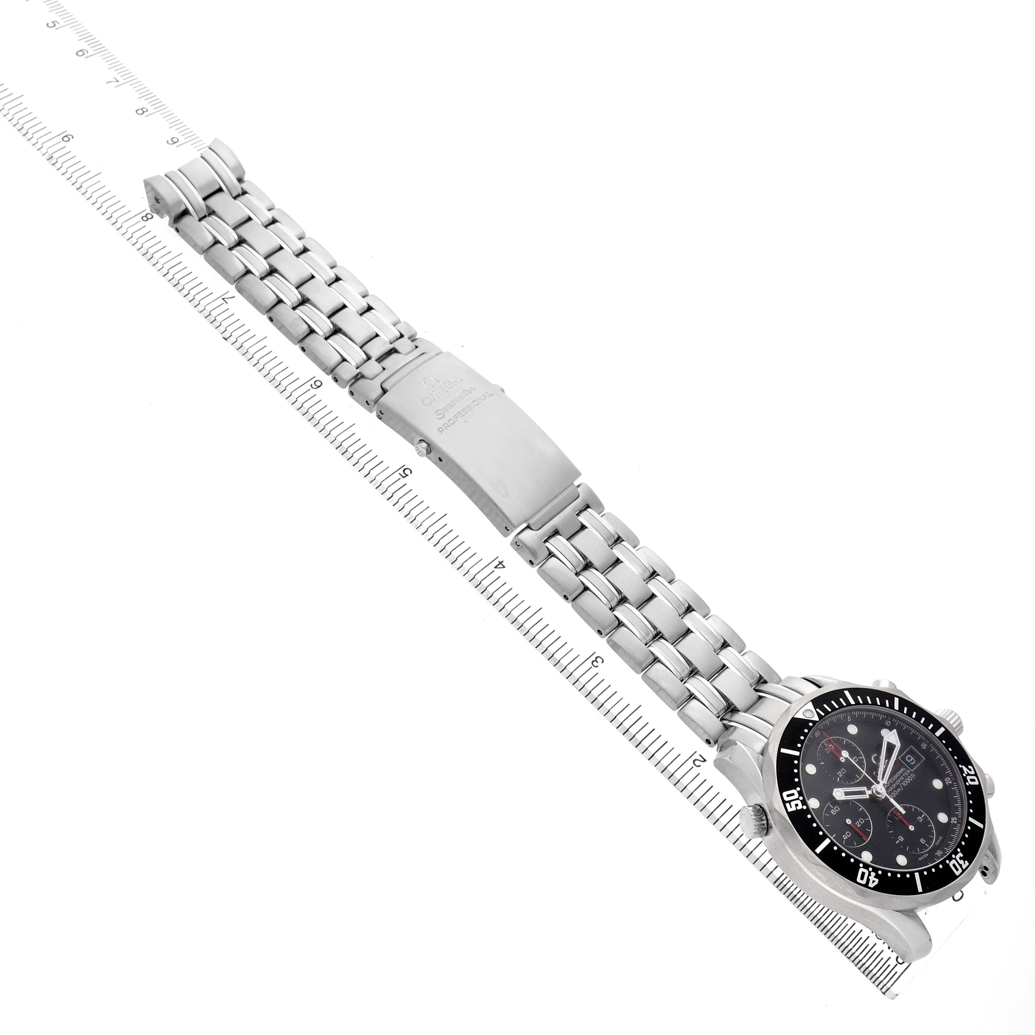 The Omega Seamaster 213.30.42.40.01.001 Men's Stainless Steel Black Dial watch is shown at a slight angle, displaying the face, bracelet, and clasp alongside a ruler for scale.